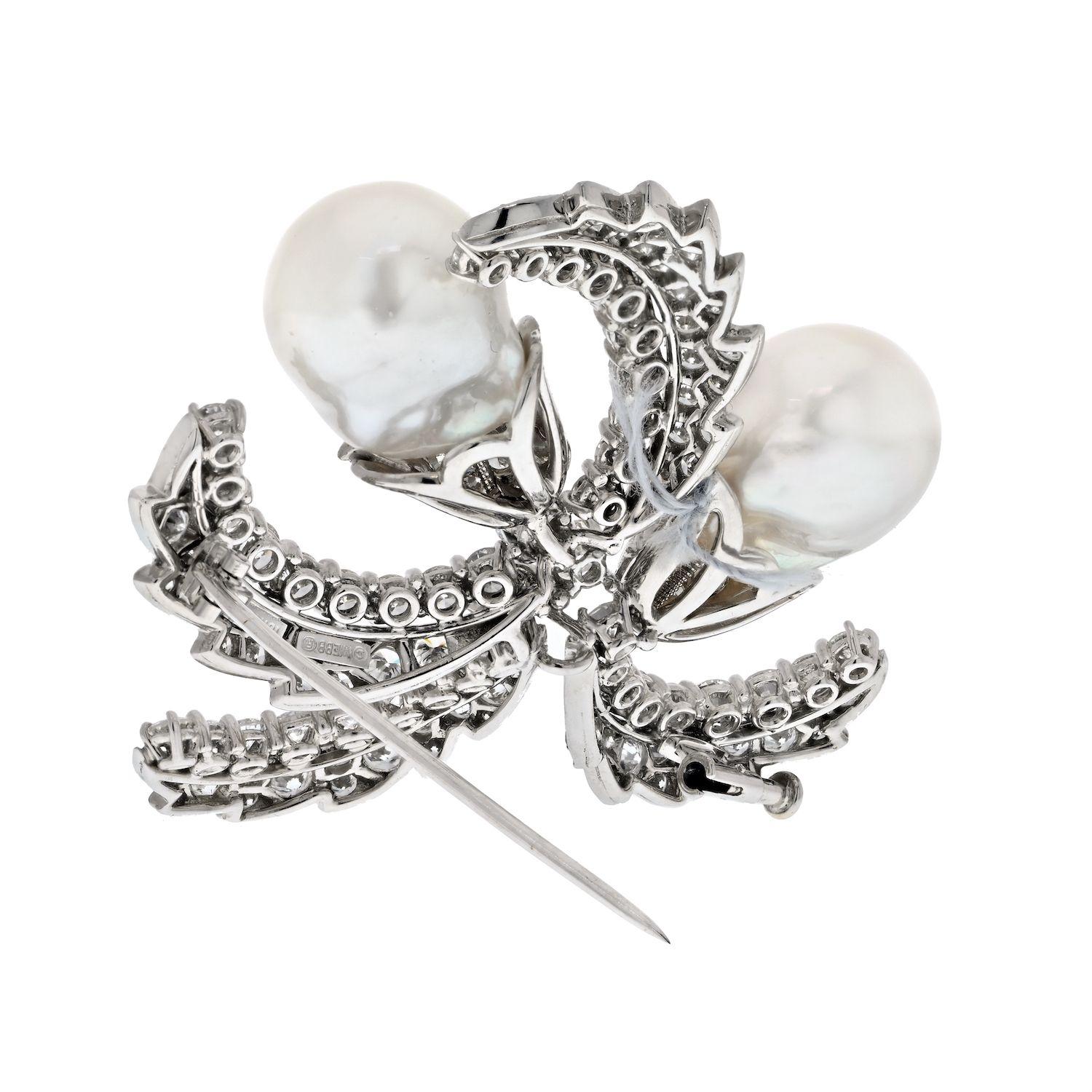 Baroque pearls and diamond brooch in platinum by David Webb. Leaves are mounted with 15cts of round cut diamonds. Spectacular size and spread. Diamonds are of F-G color VS clarity. 
Width: 5cm. 