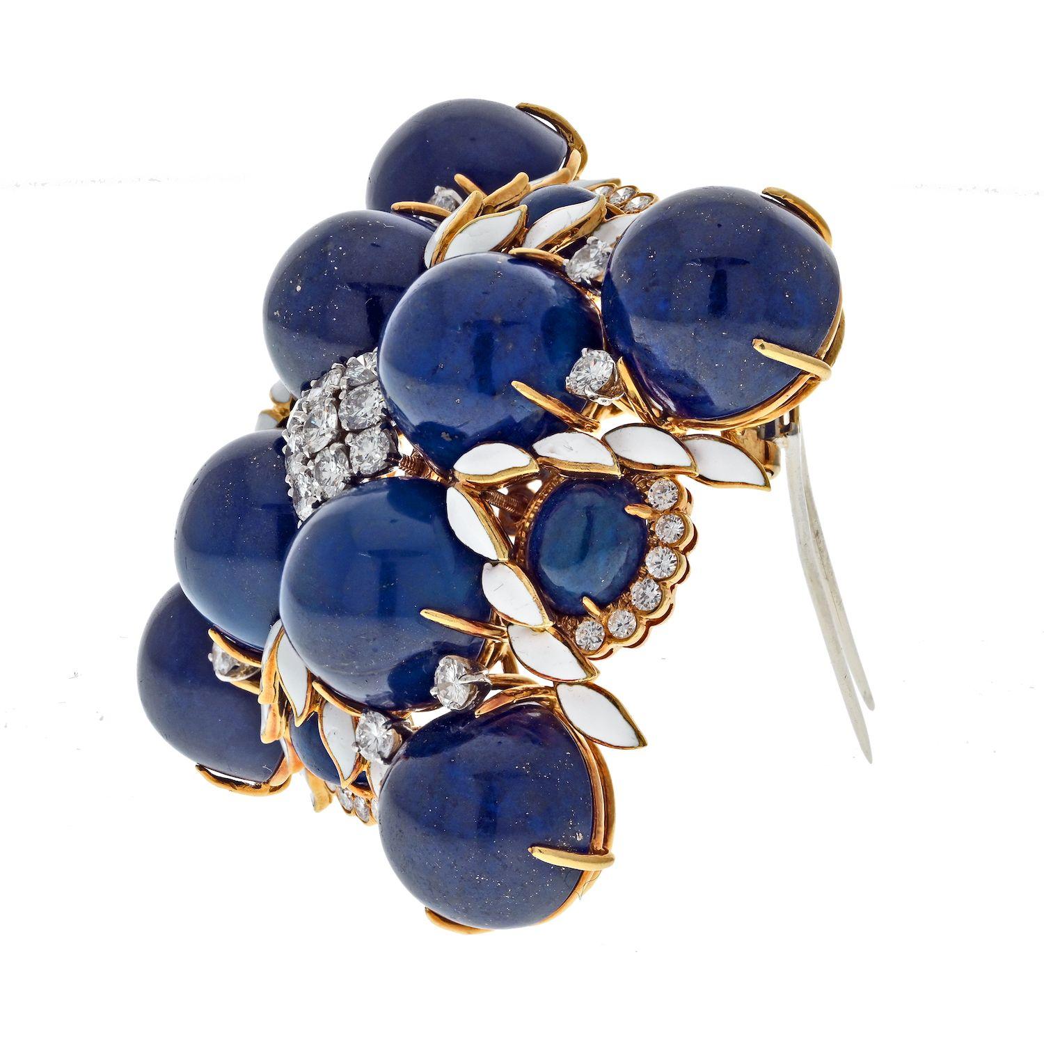 The David Webb Platinum & 18K Yellow Gold 1960's Lapis, White Enamel and Diamond Maltese Cross Style Brooch is a remarkable piece of jewelry that captures the essence of David Webb's iconic style. Crafted in a combination of platinum and 18K yellow