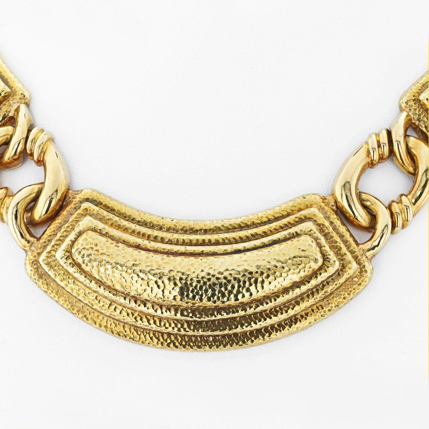 The David Webb 18K Yellow Gold Collar Ancient World Necklace is so wearable because it showcases a timeless design that can be easily incorporated into any outfit. The collar style provides a flattering fit for a range of necklines, while the