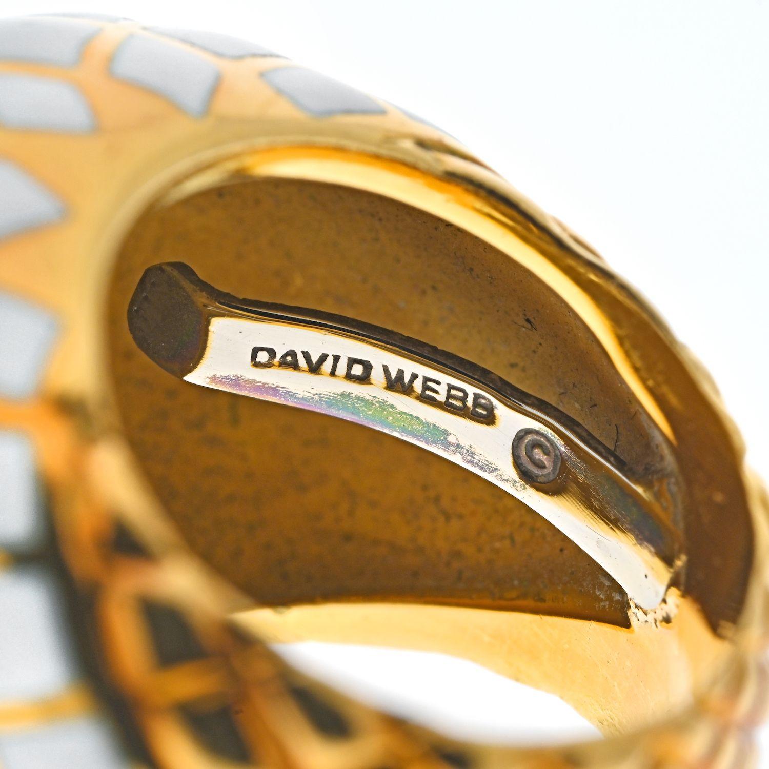 Classic ring by David Webb that is an iconic staple: a bombe yellow gold enameled ring.
This one is a lovely ring crafted in 18k yellow gold, applied with white enamel on it's bombe shaped shank. 
Elegant, yet never boring this is what we love about