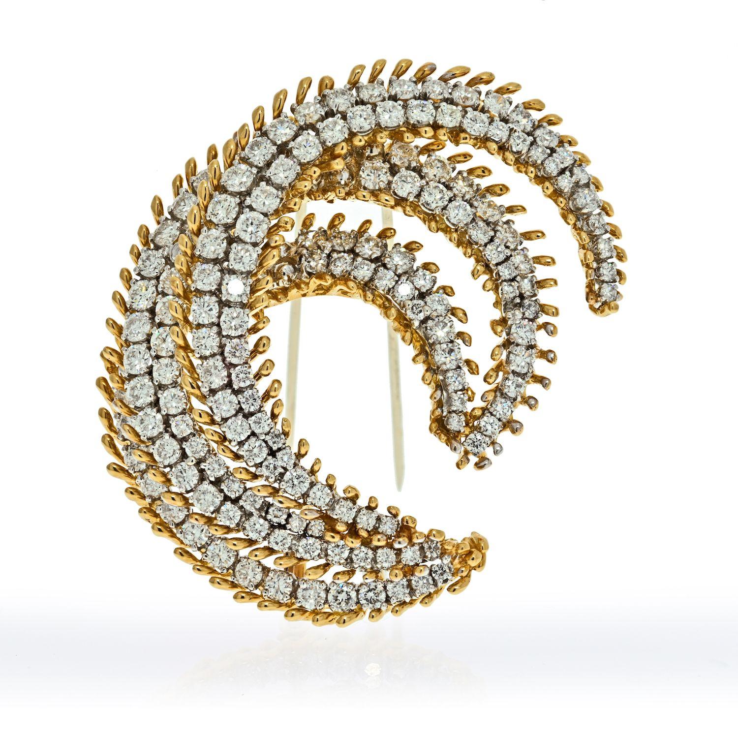 David Webb diamond and gold brooch crafted in 18k gold and platinum in a swirl Crescent motiff. This lovely brooch is set with round cut diamonds of approx. 12 carats. 
Brooch measures 2.25 inches. 