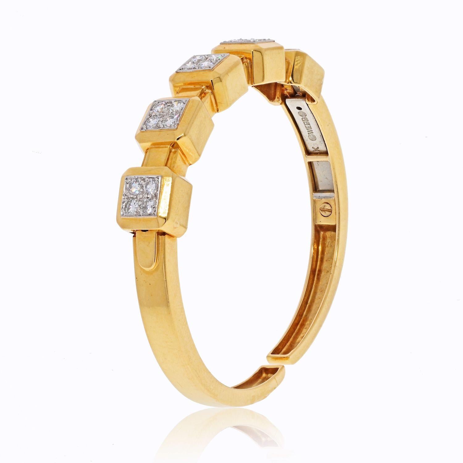 18k yellow gold hinged cuff bracelet features a cube square pattern accented by brilliant-cut diamond centers set in platinum. Total diamond weight 1.75cts.
This bangle is an ideal fit for someone with a smaller wrist size, approx. 6 inches. 