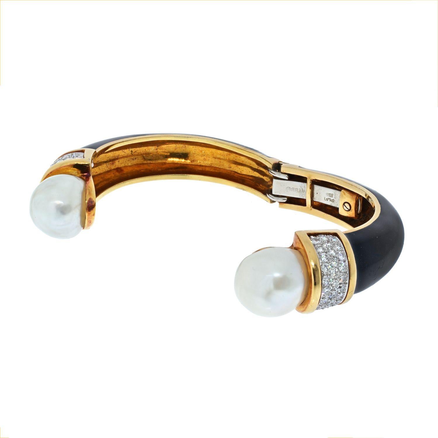 You'll love wearing this bold and beautiful David Webb hinged cuff bracelet crafted in 18k yellow gold and platinum, ends are punctuated with button cultured pearls and diamonds.
Work from 1970's. 
Inside circumference 14 cm. 