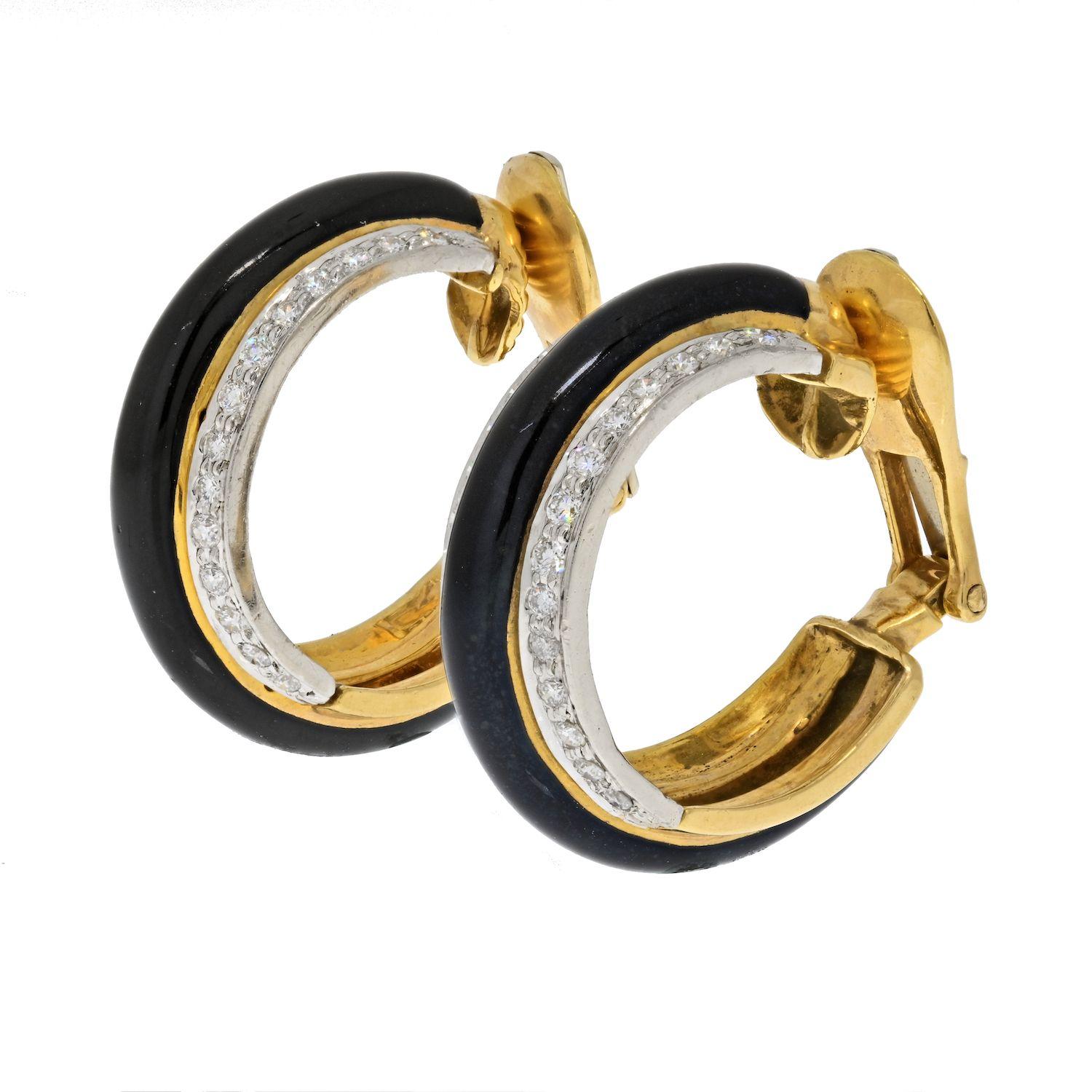 These David Webb earrings are round hoops composed of 18K yellow gold with black enamel and diamonds. The design of these hoop earrings illustrates the creativity of the house of David Webb. Rather than a one row of diamonds David Webb applies bold
