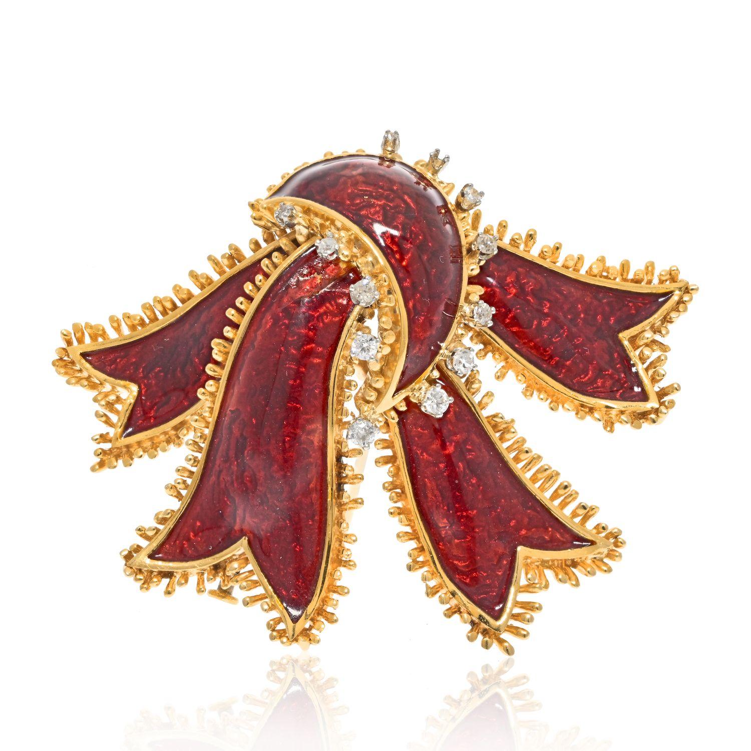 David Webb was a masterful designer of jewelry, creating pieces that are both beautiful and unique. One such piece is his 18k yellow gold brooch fashioned in the shape of a ribbon, applied with vibrant red enamel, and set with just a few round