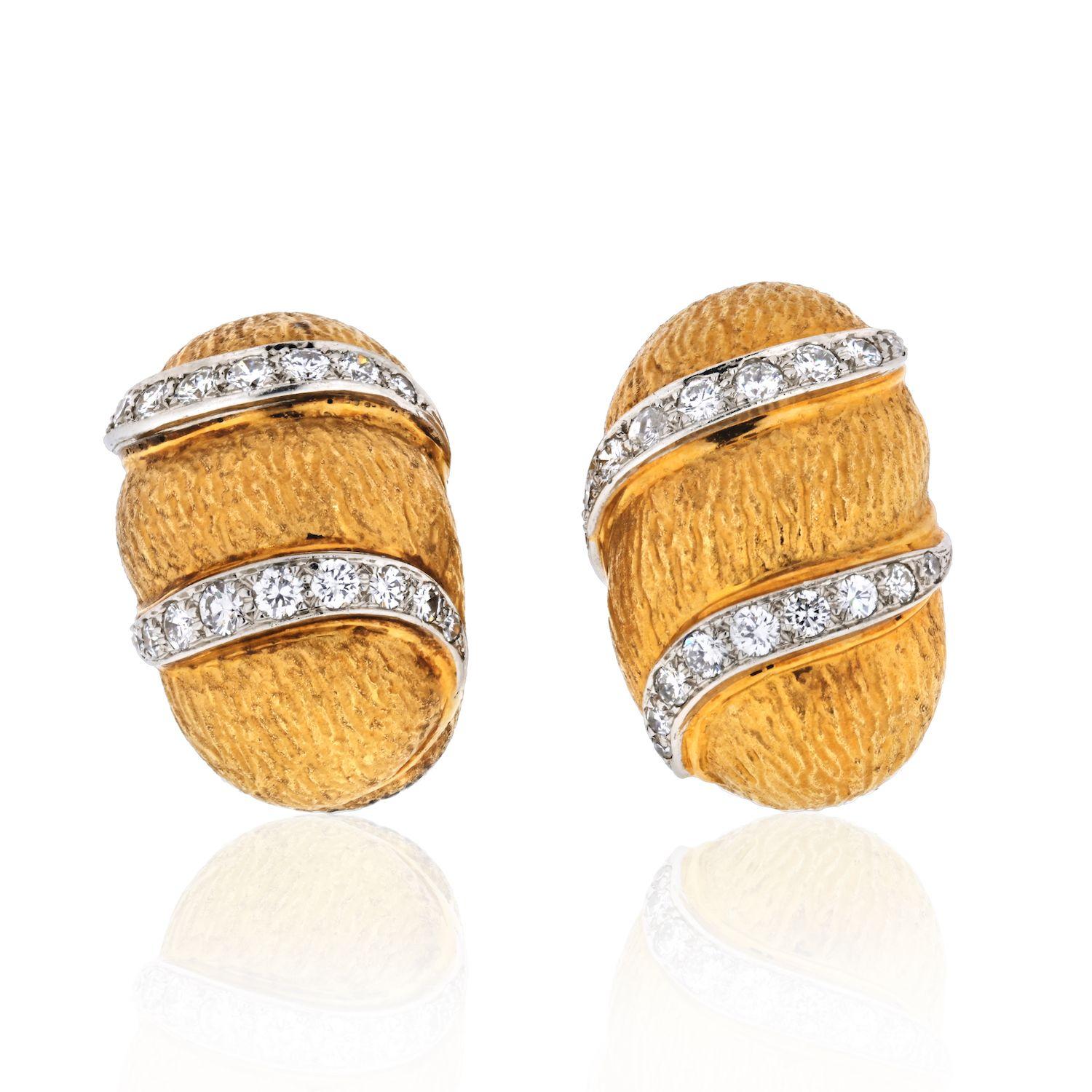 David Webb yellow gold hoop bombe style clip on earrings circa 1970. Love them because they caught your eye with the little line of pave set diamonds 0.25cts approx. Perfect in length. 
Remember that nothing feels as good as gold, particularly David