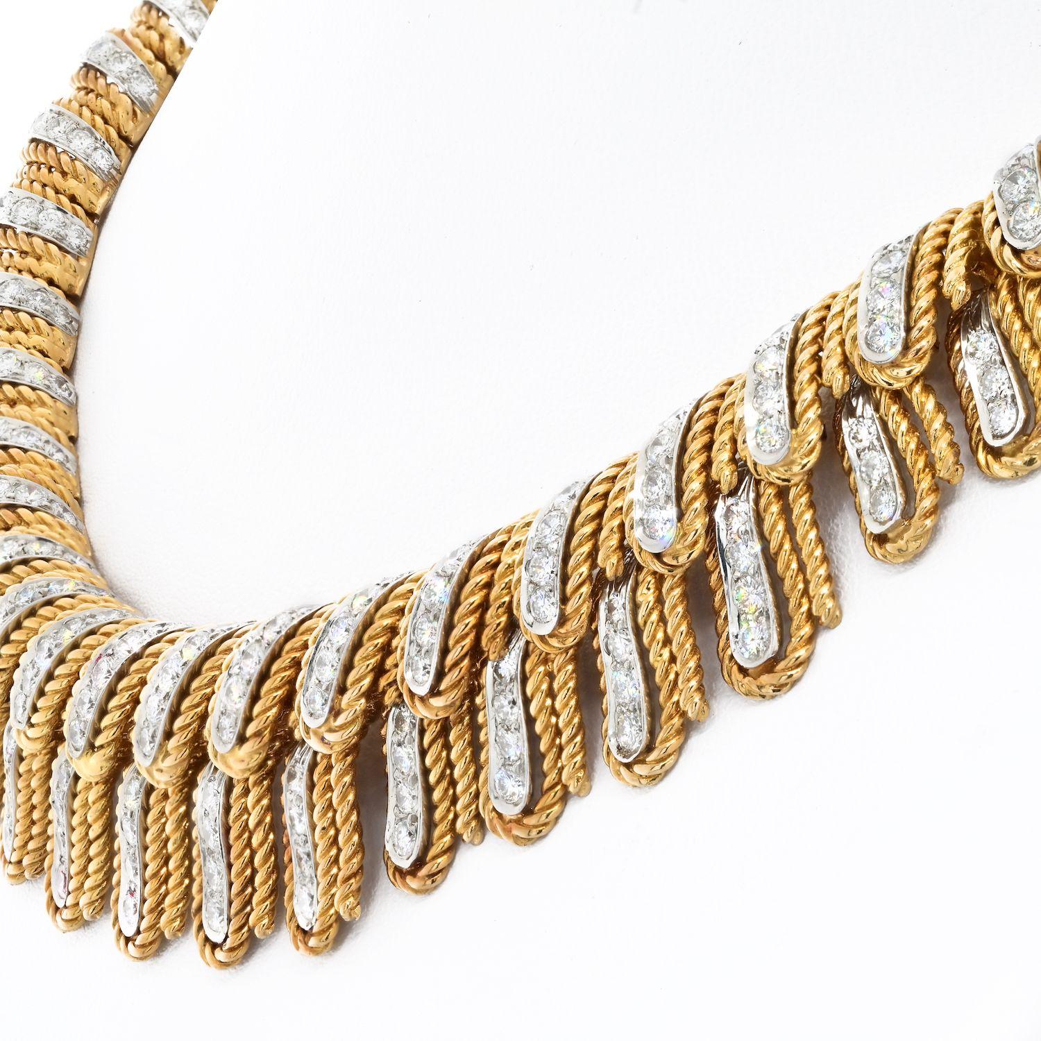 The 18k and platinum David Webb collar necklace stands out due to its unique design of diamond-set feathers within rope surrounds. The graduating size of the feathers adds to its beauty, making it a spectacular piece of jewelry. 
To make a statement