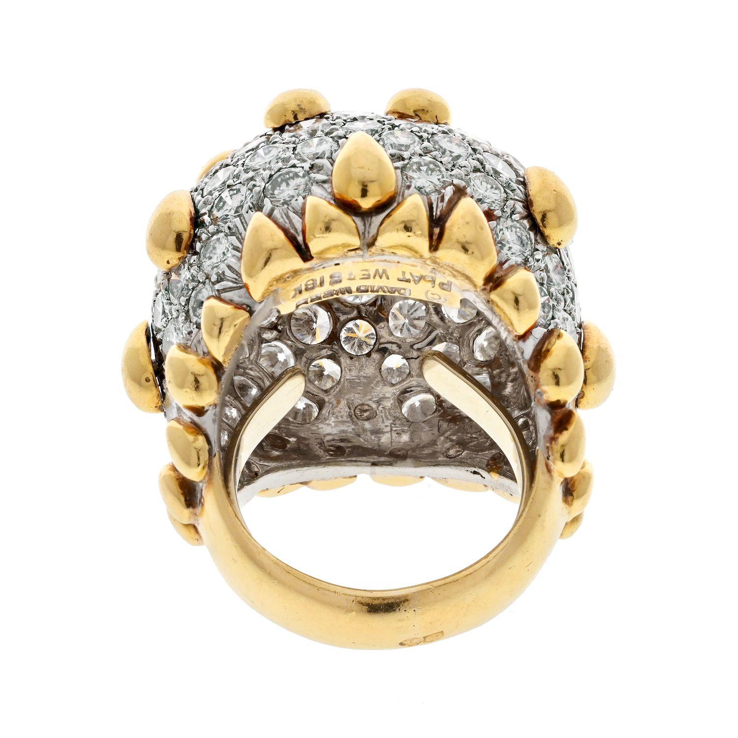 The diamond dome ring designed by David Webb is a true masterpiece of jewelry design. It is crafted in platinum and 18k yellow gold, which give the ring a classic and timeless appeal. The ring features a stunning diamond dome surface that sparkles