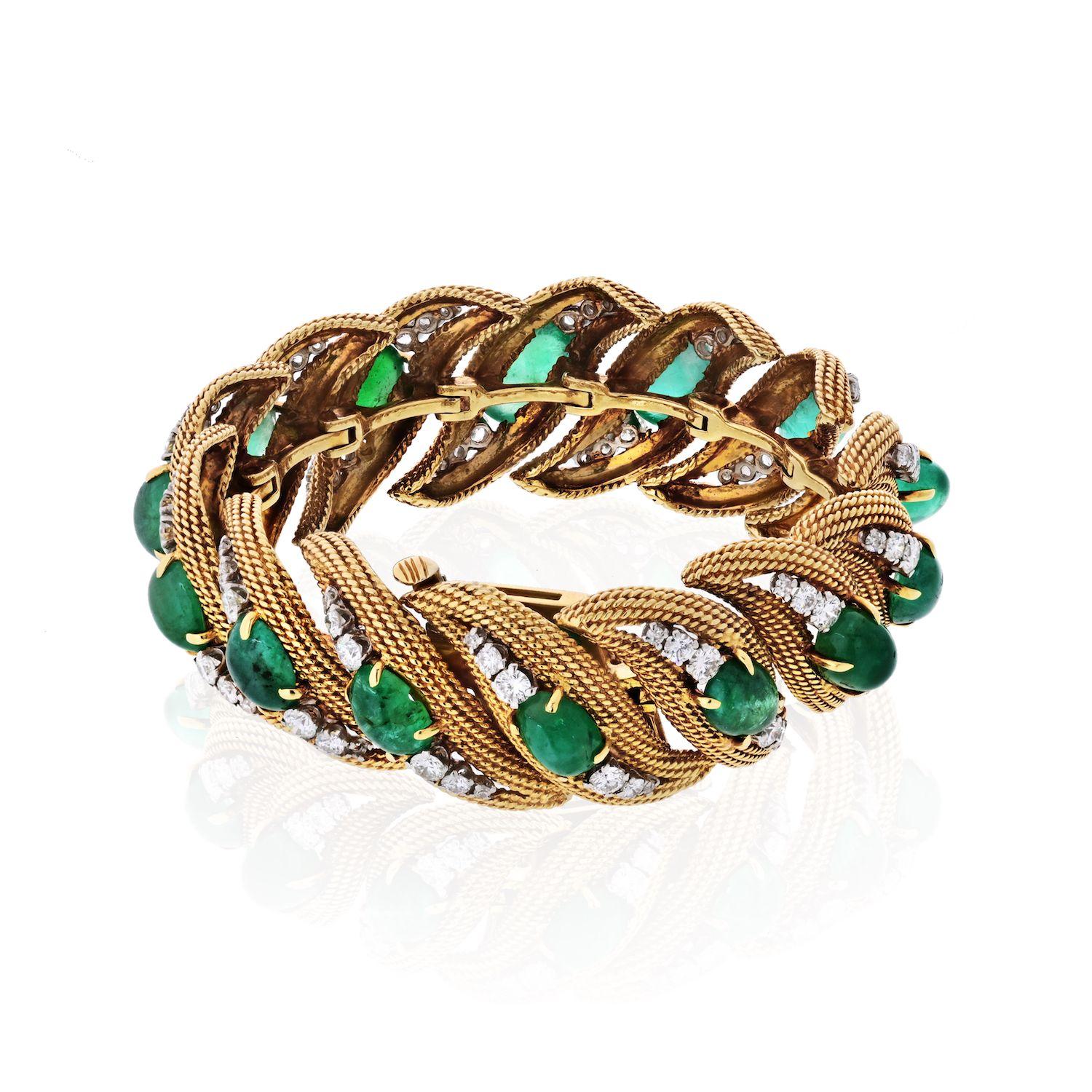 Vintage bracelet by David Webb crafted in 18K Yellow Gold and Platinum, mounted with 14 lovely green cabochon emeralds and round cut diamonds. 
Bracelet Width: 0.8 inches 
Inside Circumference 6.5 inches