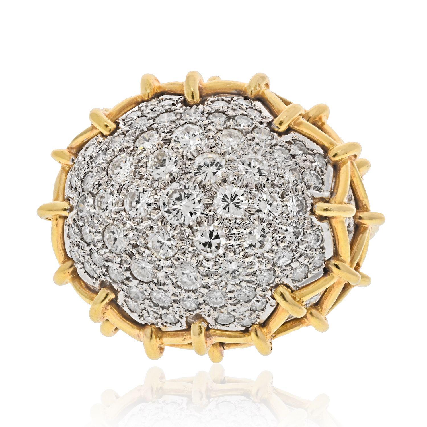 A pavé-set, platinum, and 18 karat gold Geodesic Dome diamond ring, by David Webb, first made in c. 1965.
The ring measures a Size 7. It is signed WEBB, stamped 18k, and Plat. The ring has approximately 7 carats in round cut diamonds. 