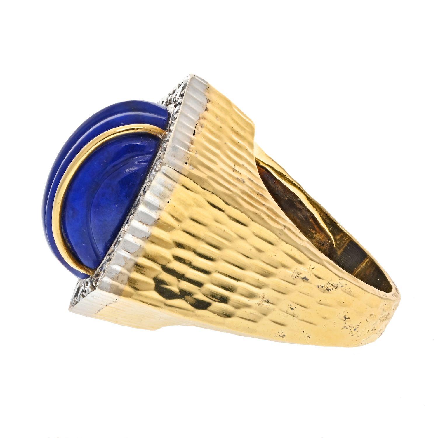 David Webb's lapis lazuli and diamond yellow gold ring is a beautiful and unique piece of jewelry. Lapis lazuli is a semi-precious stone that has been treasured since antiquity for its intense blue color. Platinum backdrop of the diamonds and yellow