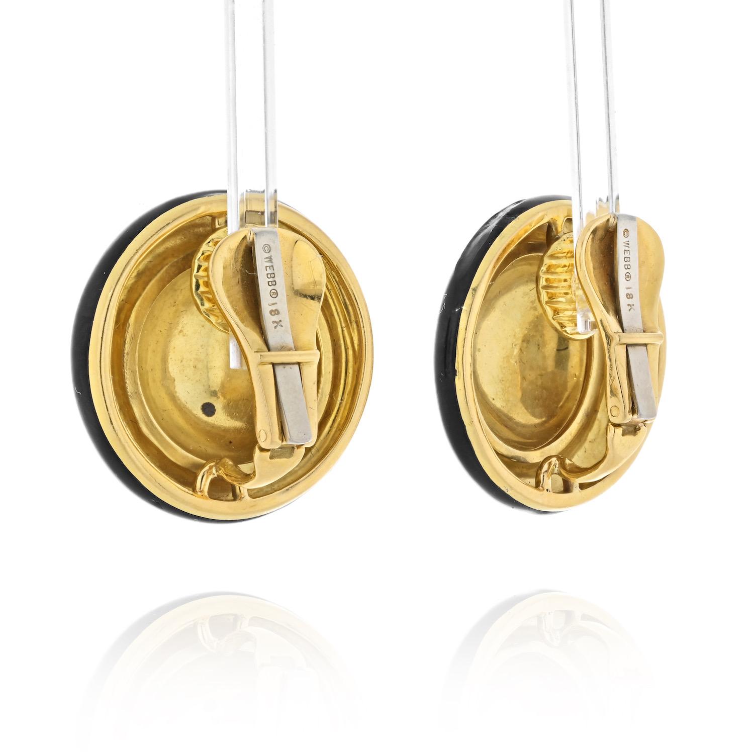 Lovely round button clip earrings by David Webb look timeless and chic at any age. These classics by David Webb have a hammered finish to the dome surface and a high polish to the outter rim. These earrings measure exactly 1 inch wide. Clip on