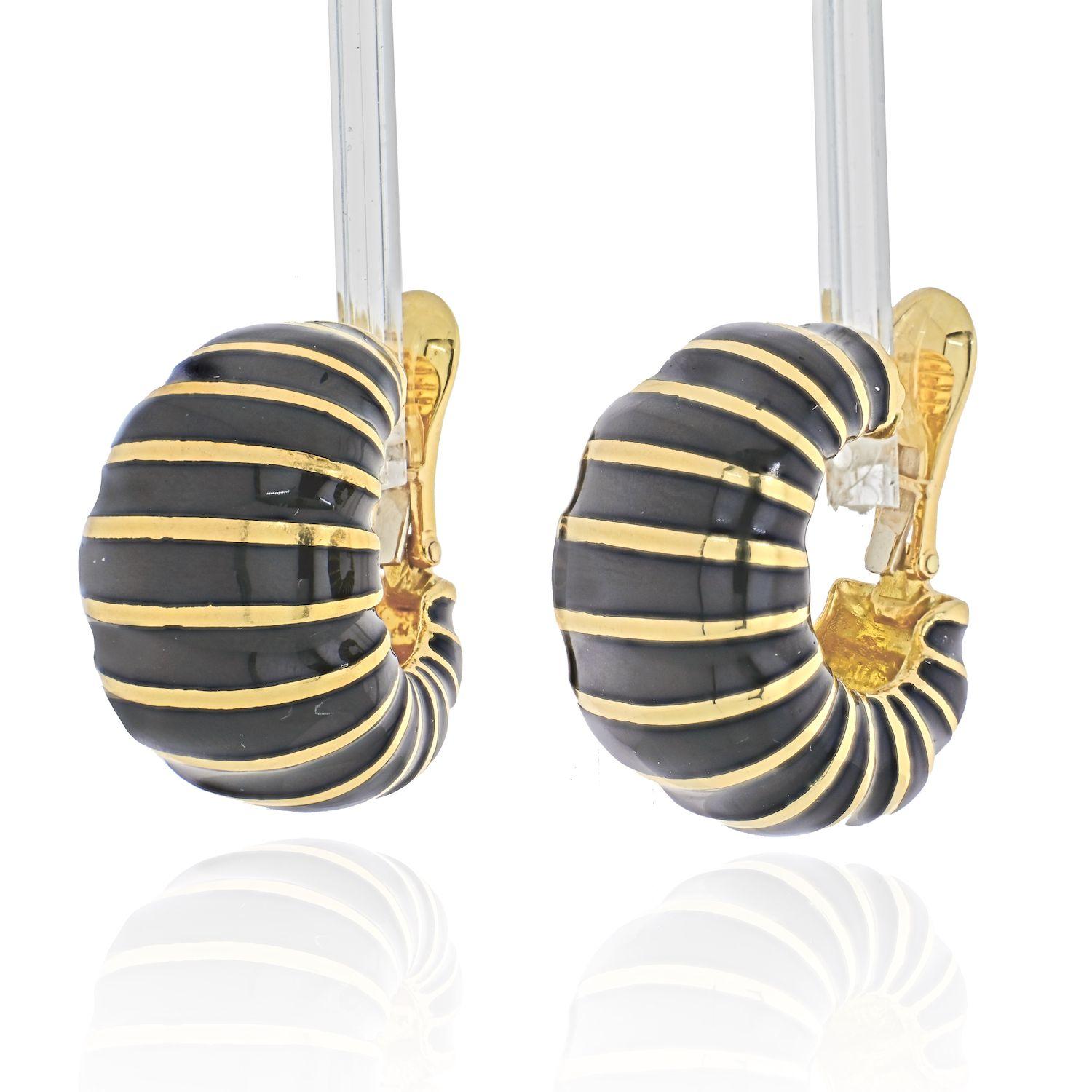 Designed as large bombe shrimp gold earrings applied with black enamel and accented by horizontal gold stripes. 
30mm long.
Clip-on closure. 

