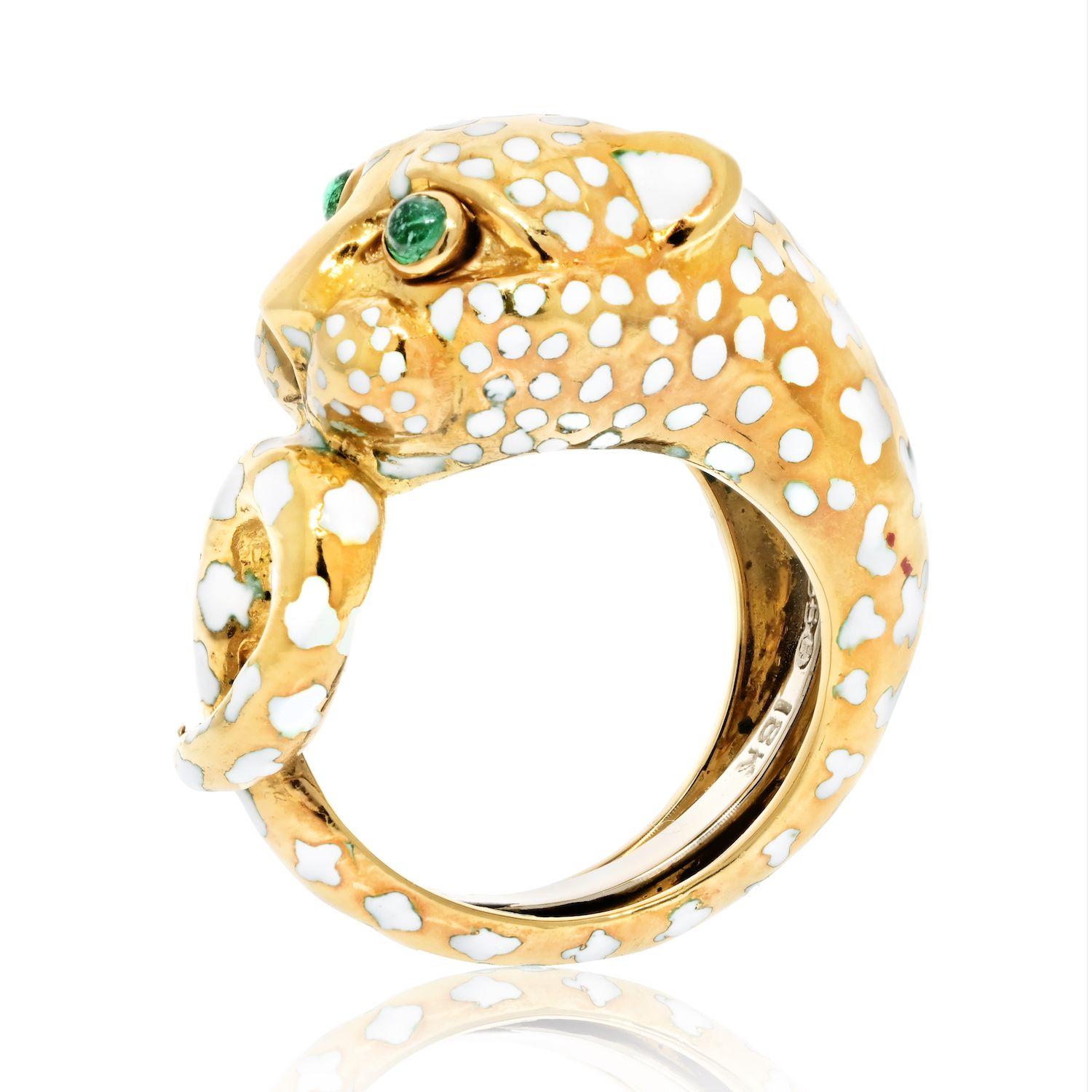 Owning this David Webb ring is truly exciting! The platinum, 18K yellow gold, and white enamel create a stunning and unique look that can't be matched. The green eyes of the leopard give the ring an extra spark of life, making it an eye-catching