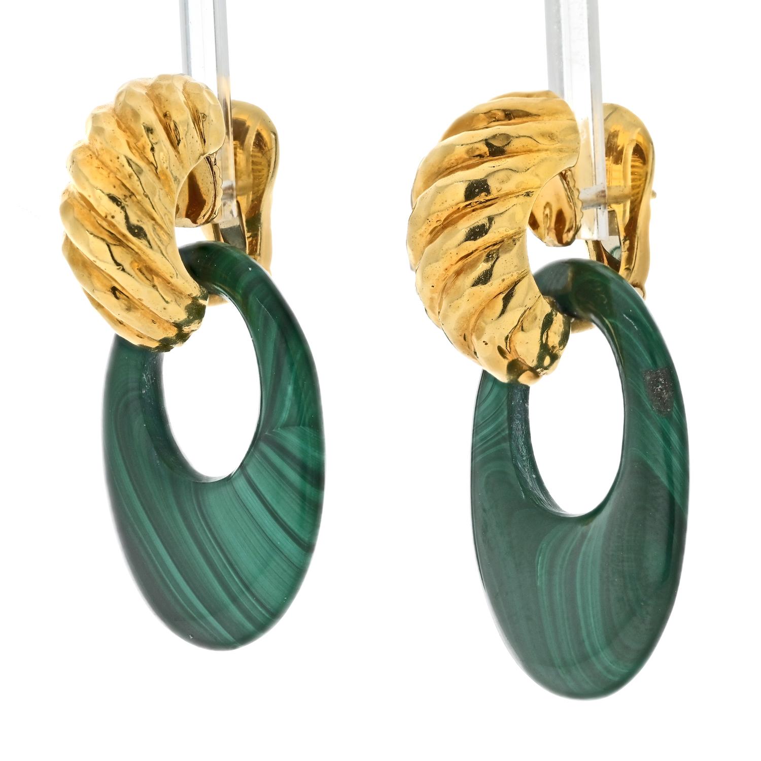 The David Webb 18K Yellow Gold Malachite Door Knockers Earrings are a stunning example of the designer's creativity and attention to detail. These earrings feature a door knocker design, with malachite stones suspended from a shrimp style fluted