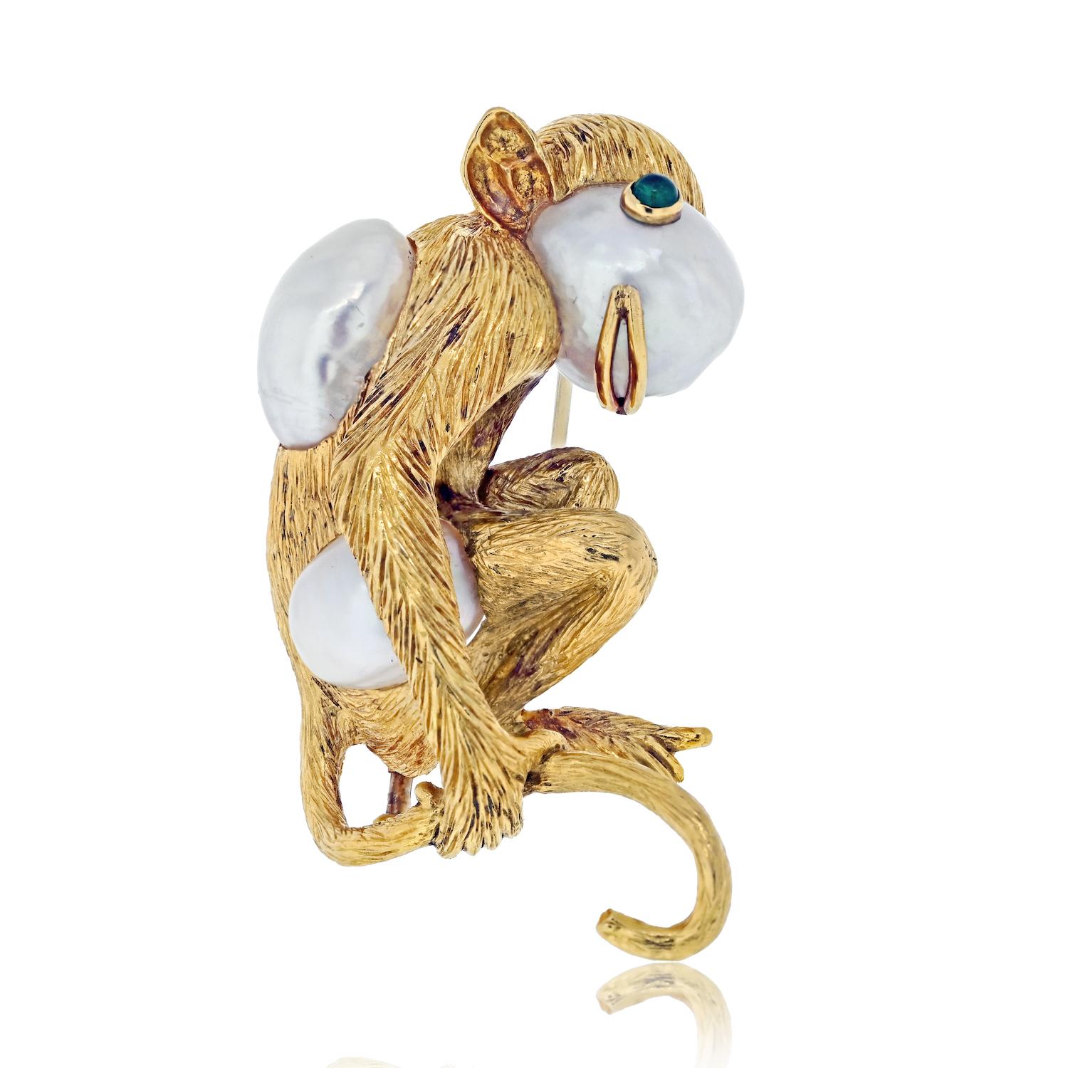 Embrace the whimsical charm of this delightful David Webb monkey brooch, a true testament to the brand's artistic brilliance. Crafted with meticulous attention to detail, this playful monkey exudes a sense of joy and curiosity. 

Set in 18k yellow