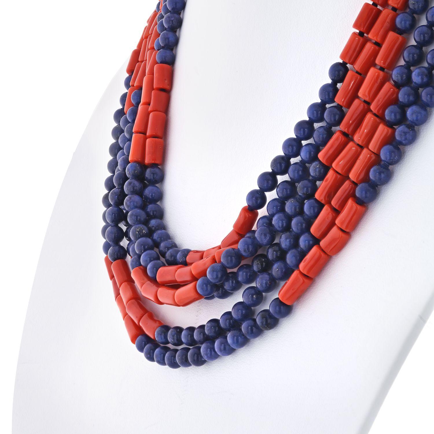David Webb Multi Strand Lapis and Coral Gold Clasp Necklace. 
The multi-strand necklace with alternating rows of rectangular coral and round lapis lazuli beads, to the clasp decorated with a rope-style gold surround, further enhanced by round