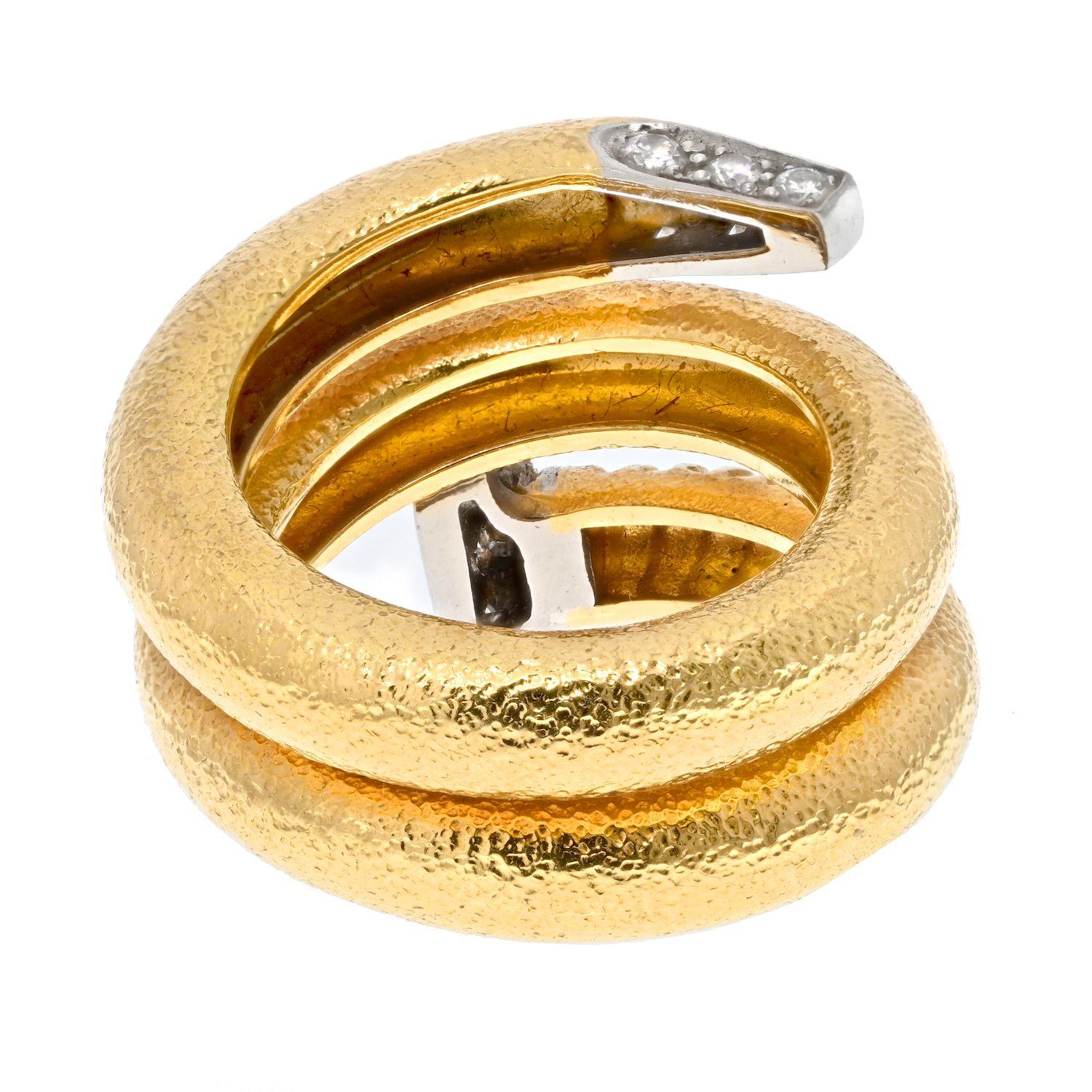 David Webb Platinum & 18K Yellow Gold Nail Ring.
Twisted nail made of hammered finish 18k yellow gold, with tip and nob encrusted with round cut diamonds. This ring is one of the most wearable David Webb rings, yet rest assured very recognizable as