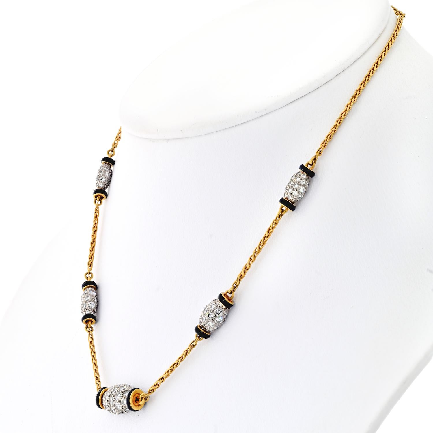 David Webb is a renowned American jewelry designer who is known for his bold and striking creations. The Platinum & 18K Yellow Gold Night Cap 5 Station Black Enamel Necklace is a testament to his design prowess. This necklace features five stations