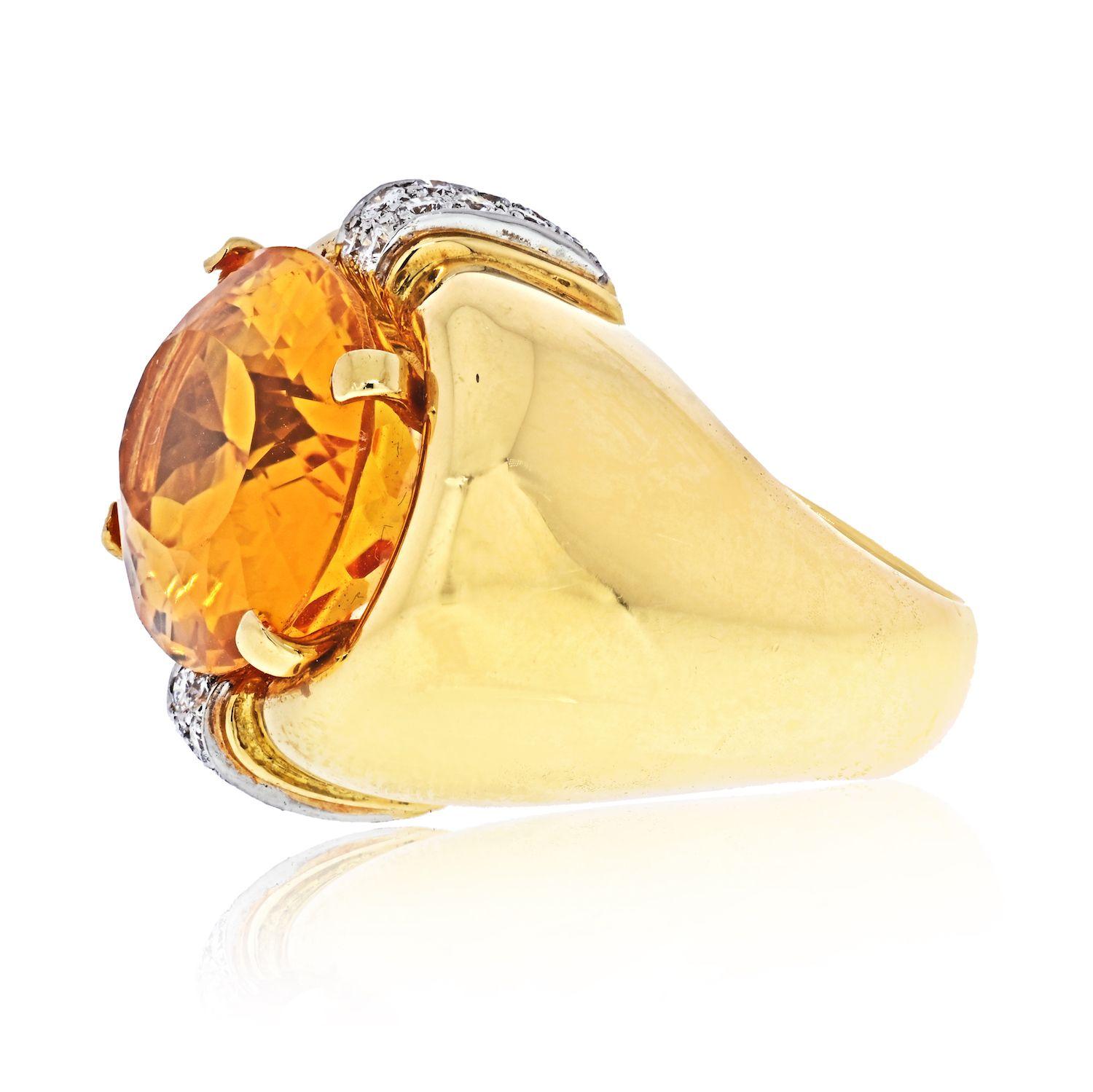 David Webb Platinum & 18K Yellow Gold Oval Orange Citrine And Diamond Ring.
Set with an oval-shaped citrine weighing approximately 17.95cts and accented by round diamonds weighing approximately 0.15ct, mounted in 18k gold and platinum, size 5 1/2,