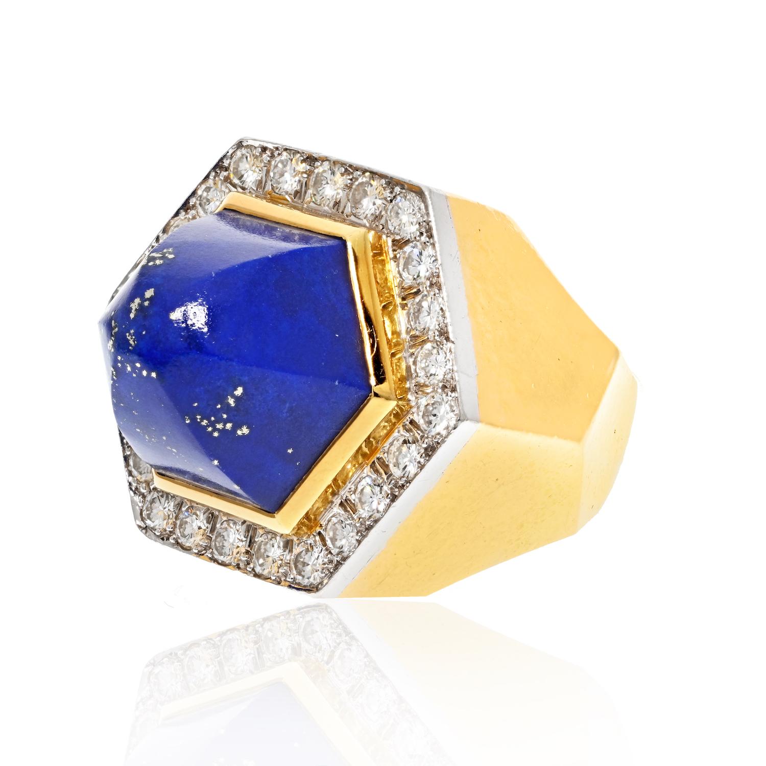 This David Webb platinum and 18K yellow gold oversized lapis and diamond ring is very special. It is crafted with exquisite craftsmanship and attention to detail. The combination of the vibrant lapis and sparkling diamonds is stunning and makes this