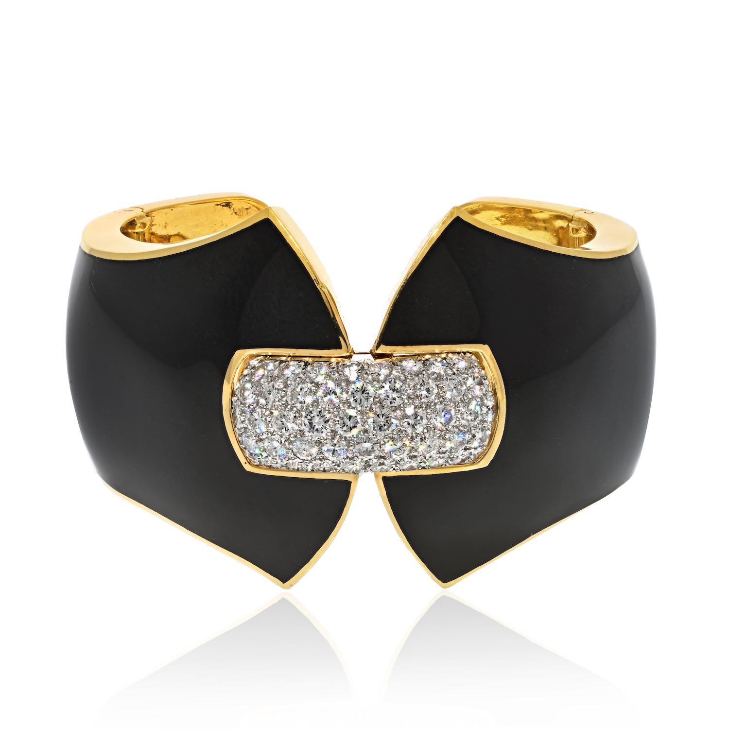 From David Webb's iconic Manhattan Minimalism collection, this exquisite black enamel and diamond cuff bracelet is a true work of art. 

Expertly crafted in 18 karat yellow gold and platinum, this bracelet features 53 round brilliant cut diamonds