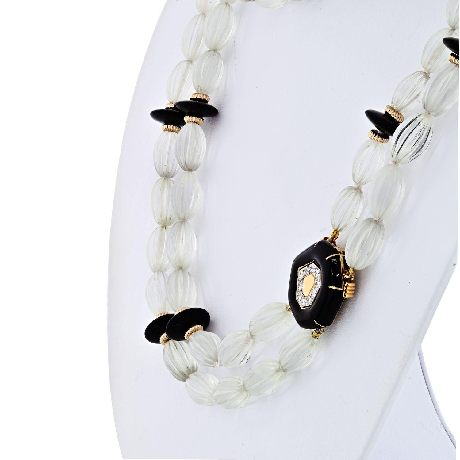 Very rare David Webb bead necklace, composed of larger barrel-shaped rock crystal beads, alternating with black onyx, 18k white gold and gold rondelles. 

Diamonds are pave set on the two larger onyx pieces. 

This necklace can be worn short, medium