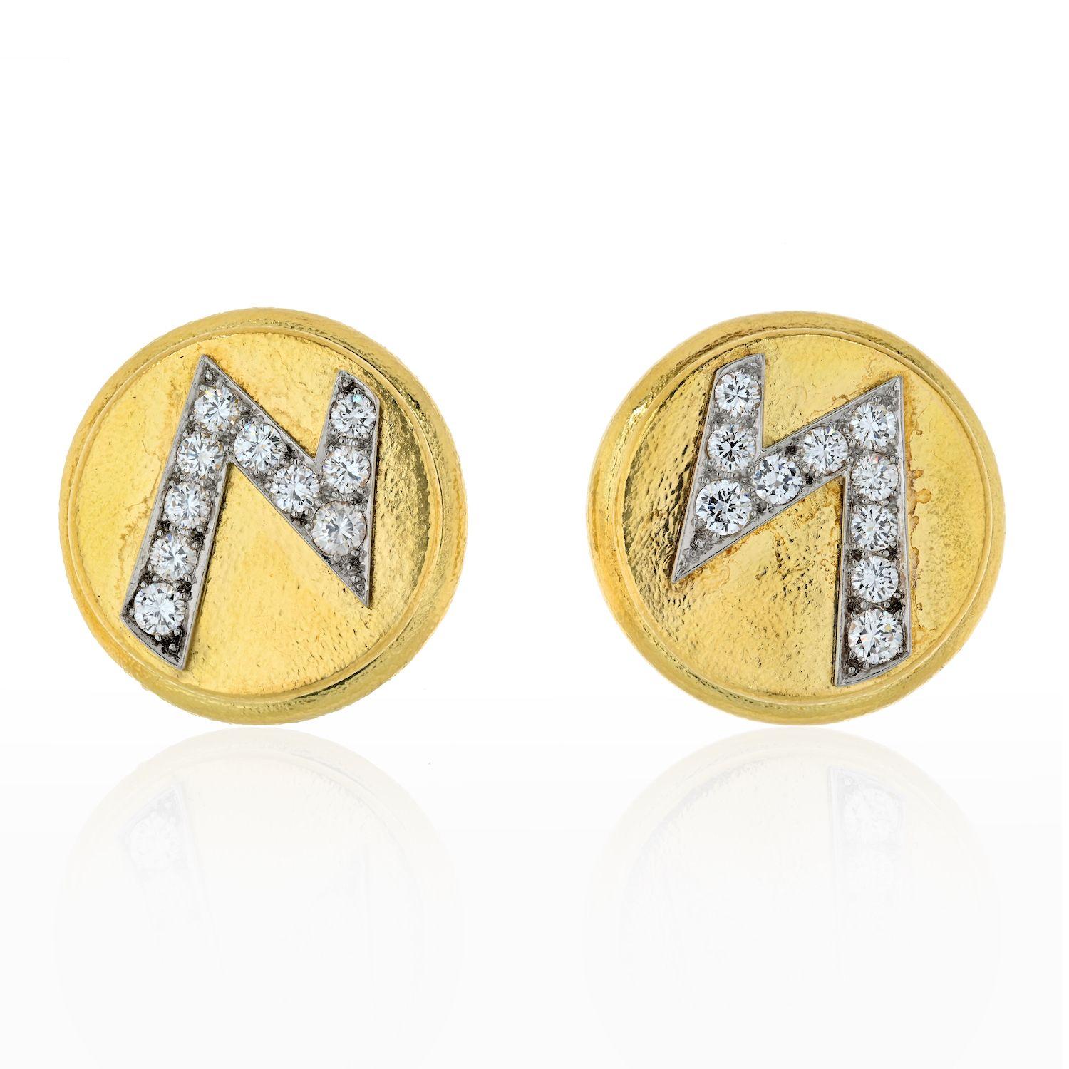 Diamond Solid 18K Yellow and White Gold Lightning Bolt Ear Clips by David Webb. 

These lovely earrings from David Webb are crafted of solid 18k yellow gold with white gold lightning bolt icons emblazoned across the piece. The lightning bolts are