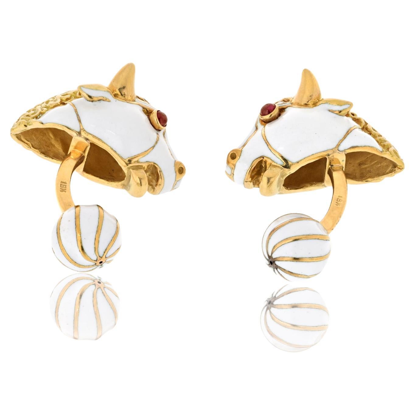 Indulge in the bold and charismatic allure of these David Webb 18k yellow gold cufflinks – a unique masterpiece that captures the essence of strength and style. Crafted in the likeness of two majestic bulls, these cufflinks are adorned with striking