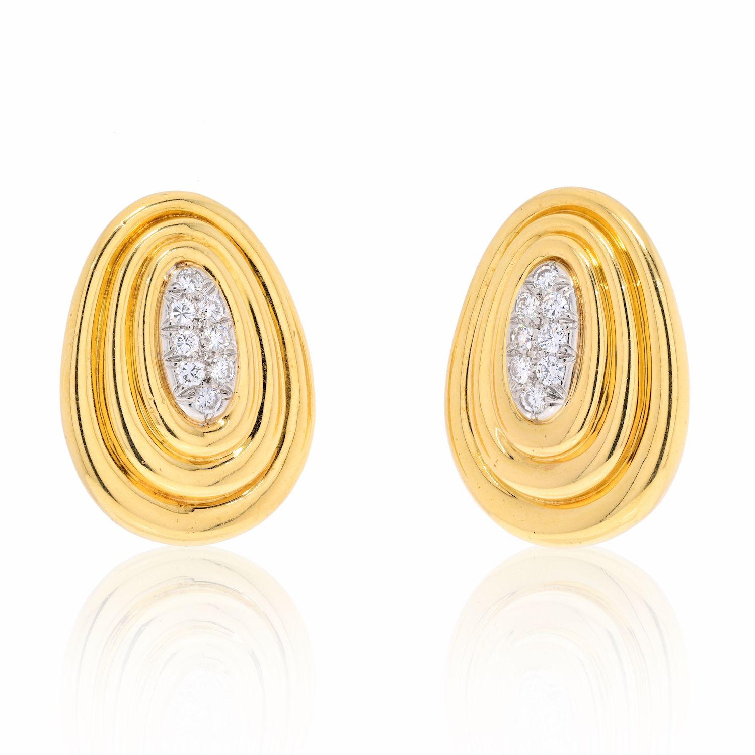 David Webb Platinum & 18K Yellow Gold Textured Gold And Diamond Earrings.
16 round cut diamonds in total weigh approx. 0.25cts. 
These earrings measure about 1.1 inches and fasten with a clip closure. 