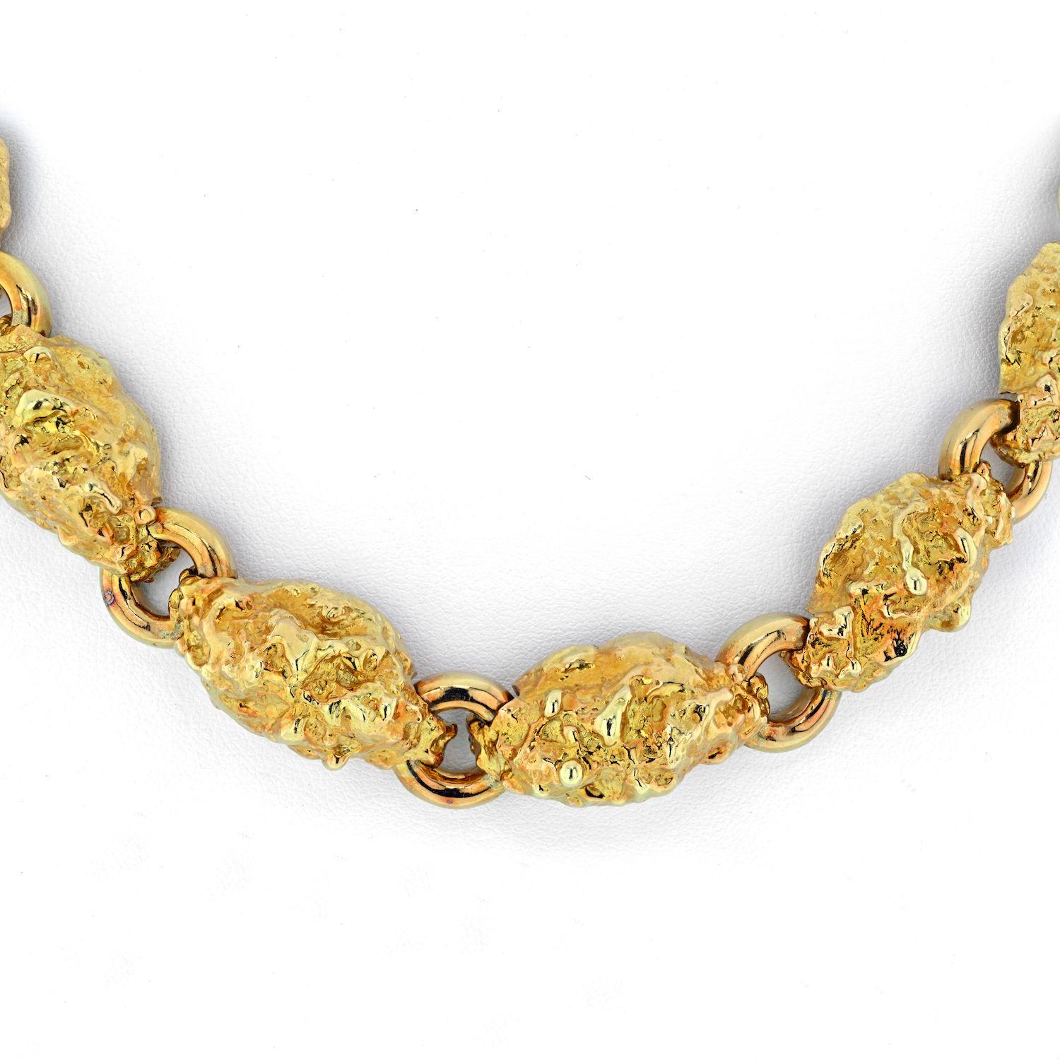Composed of 18k yellow gold nugget style links this David Webb necklace has a graduating flow. The nuggets are of solid 18k yelow gold, and sit closely to your neck right over the collar bones. This is a perfect necklace to wear with a white-T, a