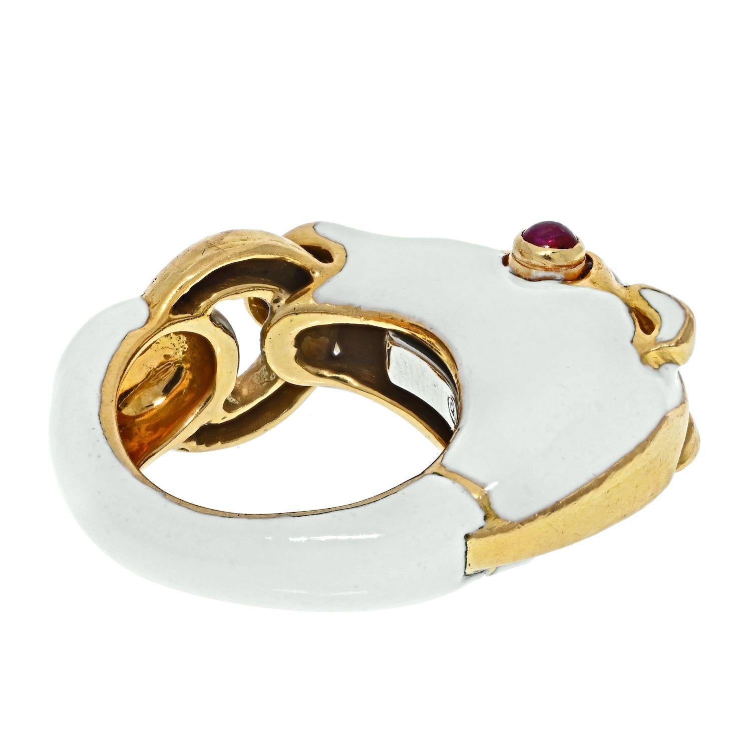 Ring designed as stylized horse head with a polished gold bit ring in mouth. With intact high gloss, opaque, white enamel body. Accented by round cabochon ruby eyes weighing approximately 0.25 carat. Transparent with medium slightly pinkish and