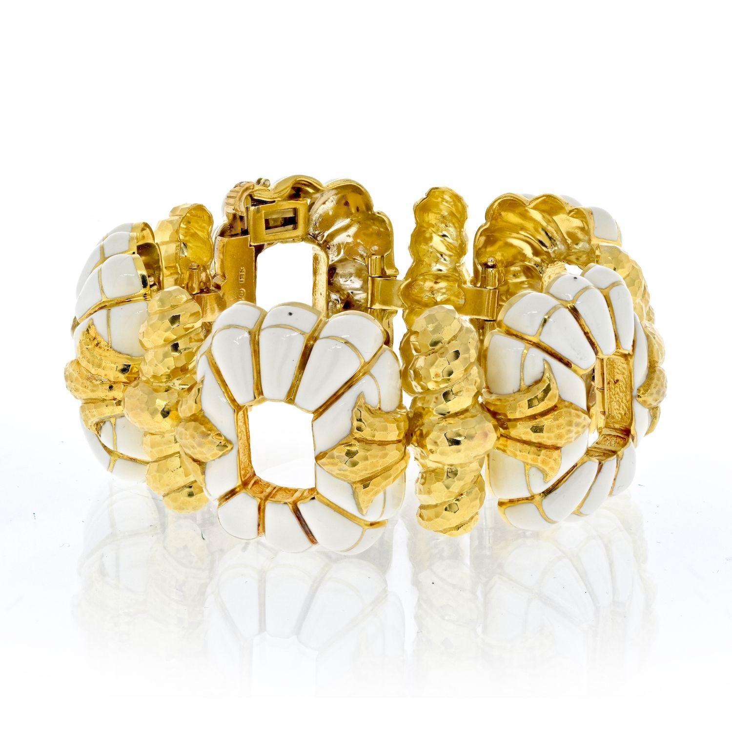 Discover the epitome of luxury with the David Webb Yellow Gold Fluted Enamel Bracelet, a true testament to the brand's iconic craftsmanship. This masterpiece is artistry personified, meticulously crafted in the form of white enameled fluted links