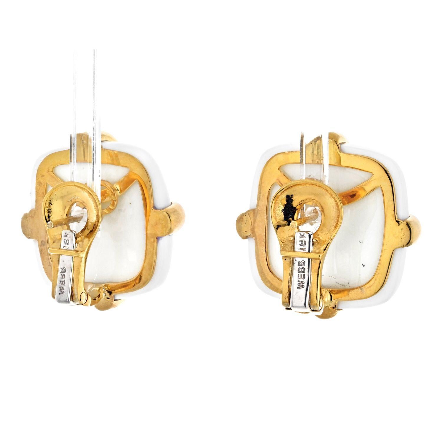 Elegant pair of clip earrings designed by David Webb. Crafted in solid yellow gold of 18 karats, with high polish finish. Embellished with a pair of squared cushioned cabochons cuts, carved from white Jasper. High polished criss cross gold wires add