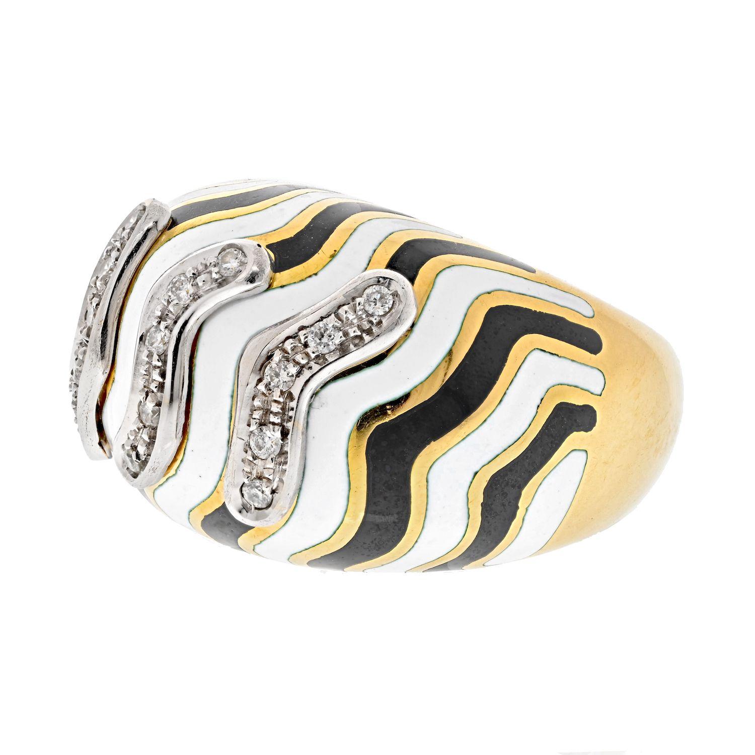 David Webb Platinum & 18K Yellow Gold Zebra Diamond Bombe Ring.
This is a lovely bombe style ring by David Webb designed with his signature zebra enameled striped pattern and a touch of round cut diamonds on the top. Perfect cocktail ring to be out
