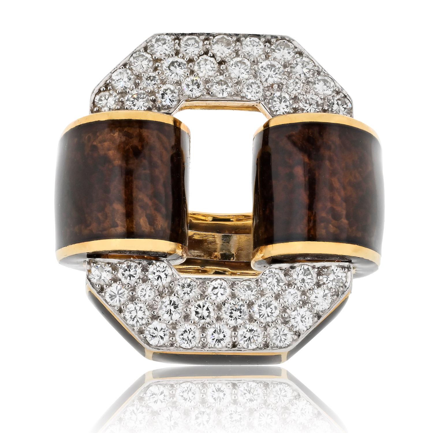 The iconic style of David Webb with the Signature Tire Ring, a captivating piece that seamlessly merges bold design with luxurious materials. This statement ring features brilliant-cut diamonds set in a distinctive pattern, accented by exquisite