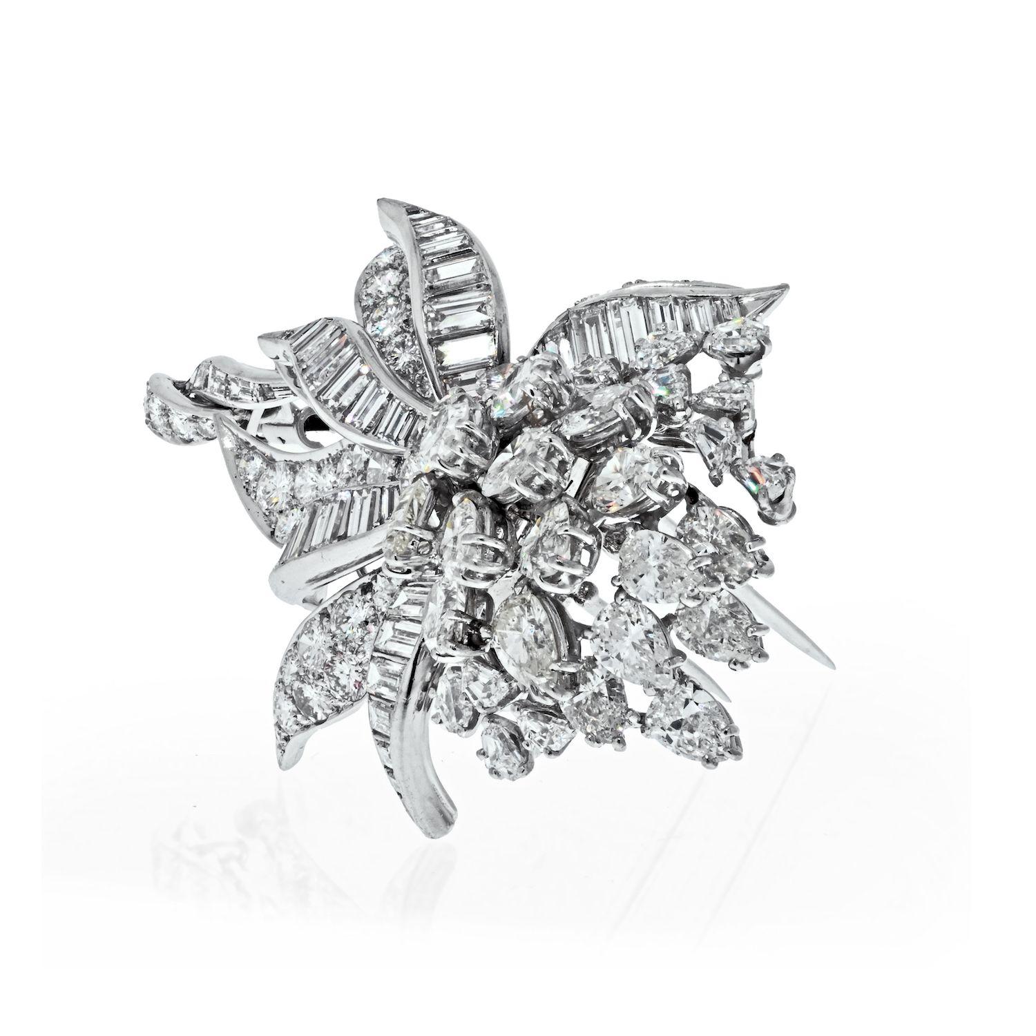 Beautiful diamond brooch by David Webb crafted in Platinum, set with lots of mixed cut diamonds: from round brilliant cuts, pear cuts to baguette cut diamonds. 21 carats of sparkly diamonds make it a perfect brooch to gift to your loved one. 
Circa