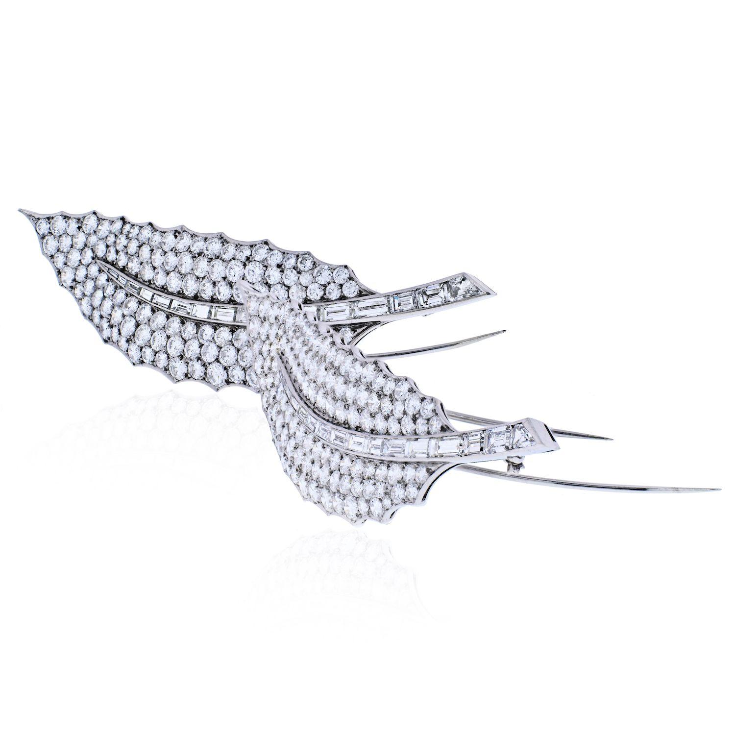 Pair of impressive platinum and 18k gold leaf brooches by David Webb, with a total of approximately 40 carats in round and baguette cut H/VS-SI1 diamonds. 

Each brooch measures 3 5/8