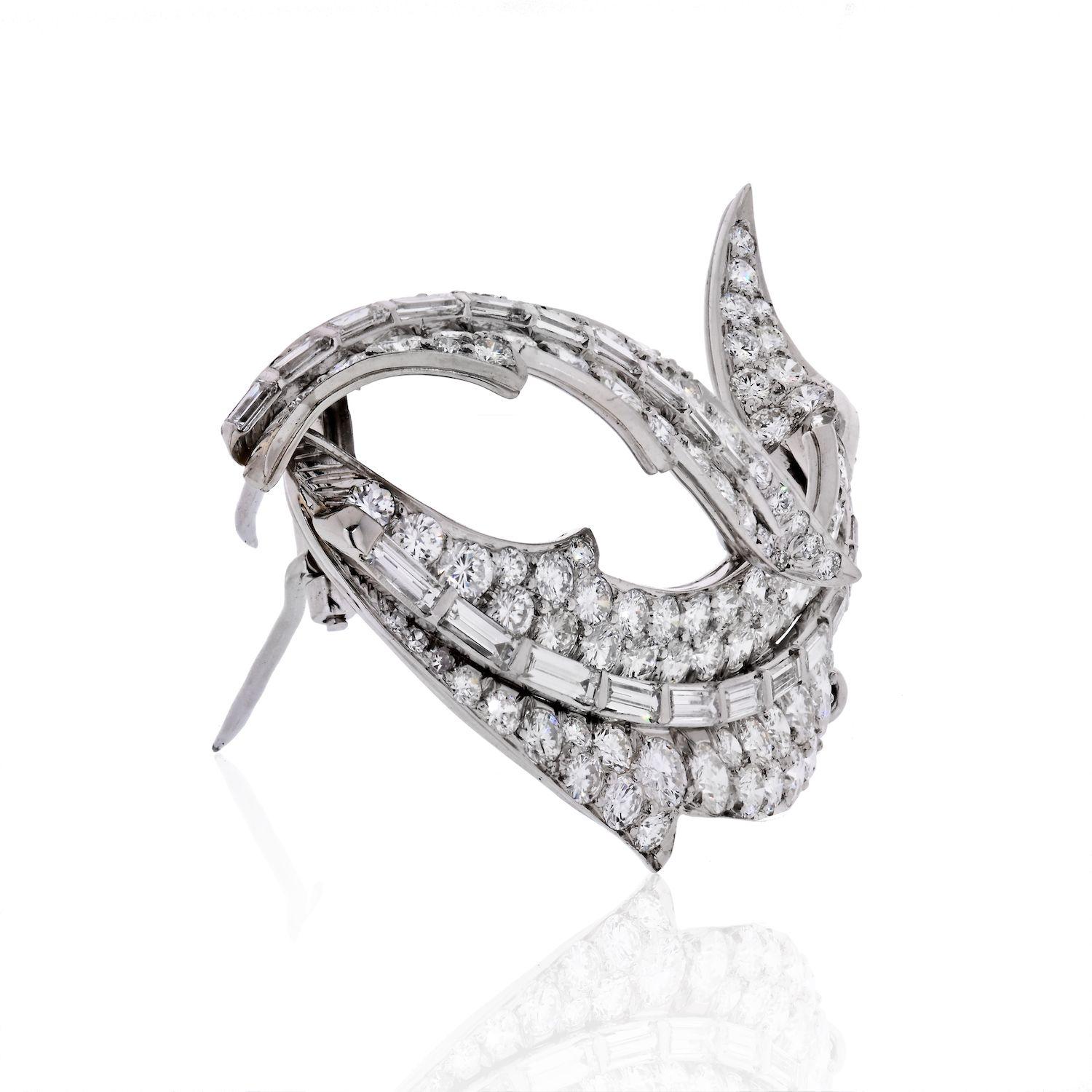 David Webb diamond swirl brooch crafted in Platinuma, mounted with round cuts and baguettes of exceptional quality. 
This brooch measures 58mm long. 
