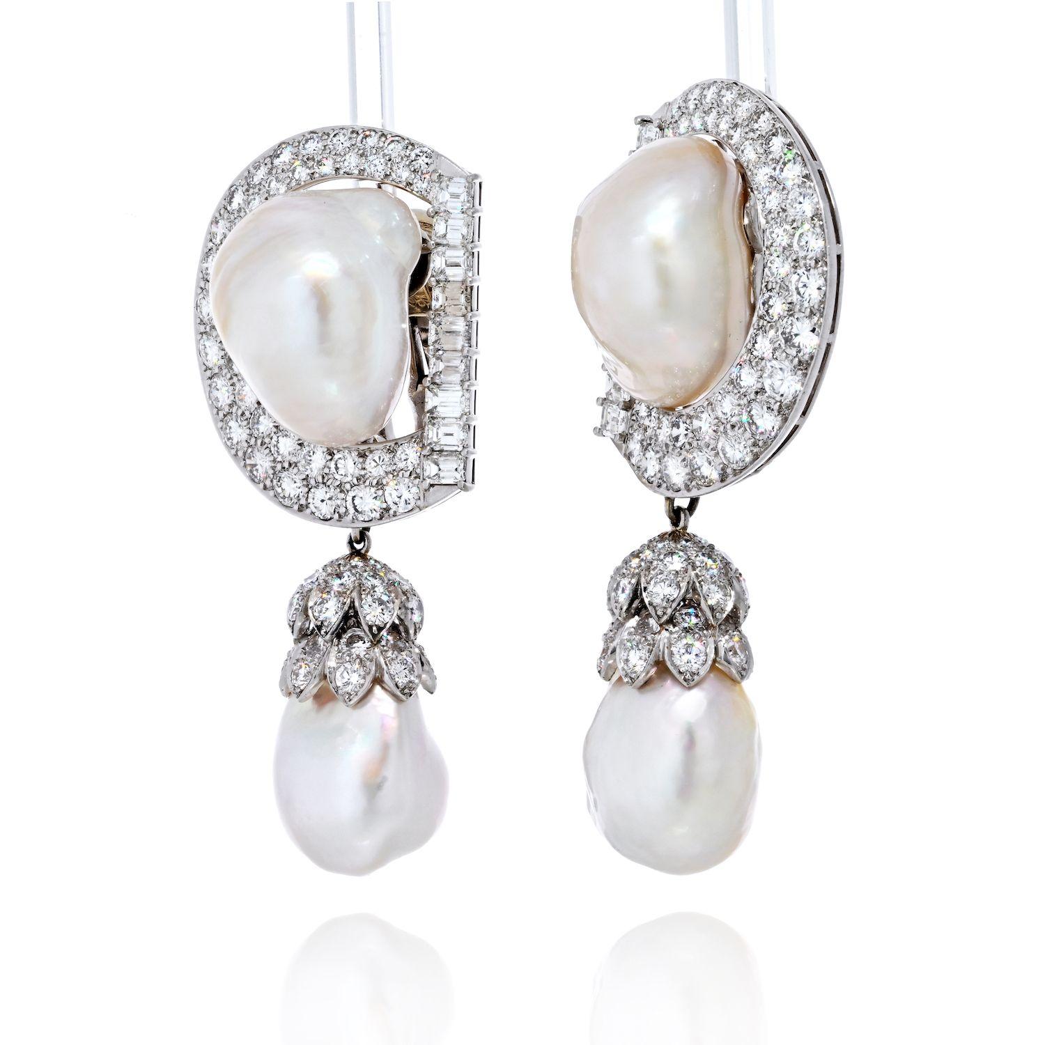 The David Webb Baroque Pearl and Diamond Drop Earrings in platinum exemplify the designer's mastery in creating breathtaking and unique pieces. This exquisite pair of earrings seamlessly blends the organic beauty of large baroque pearls with the