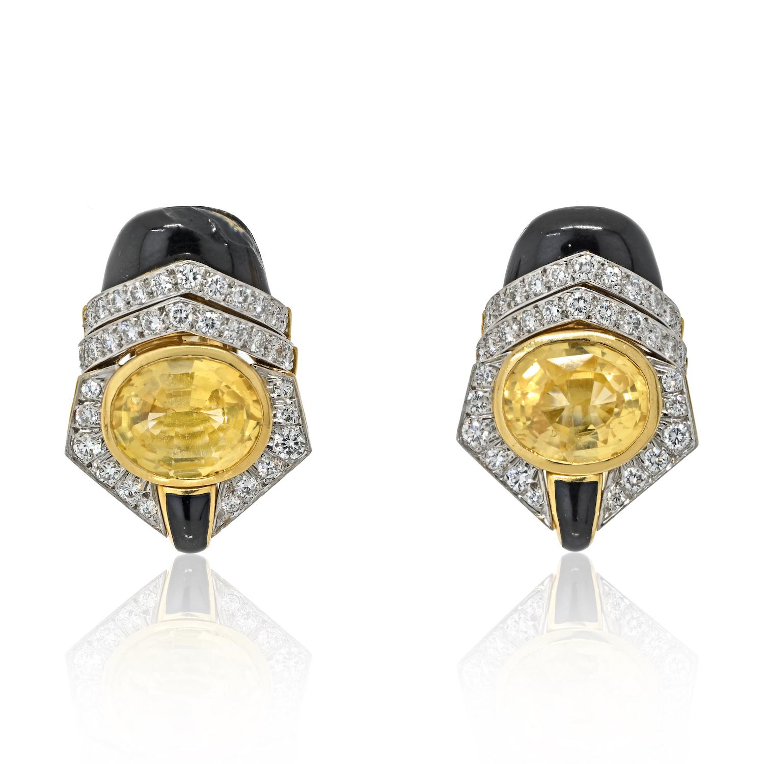 Indulge in the captivating allure of these David Webb Platinum & 18K Yellow Gold Earrings, a true testament to the designer's iconic craftsmanship and artistic vision. 

At the heart of these enchanting earrings, oval-cut yellow sapphires take