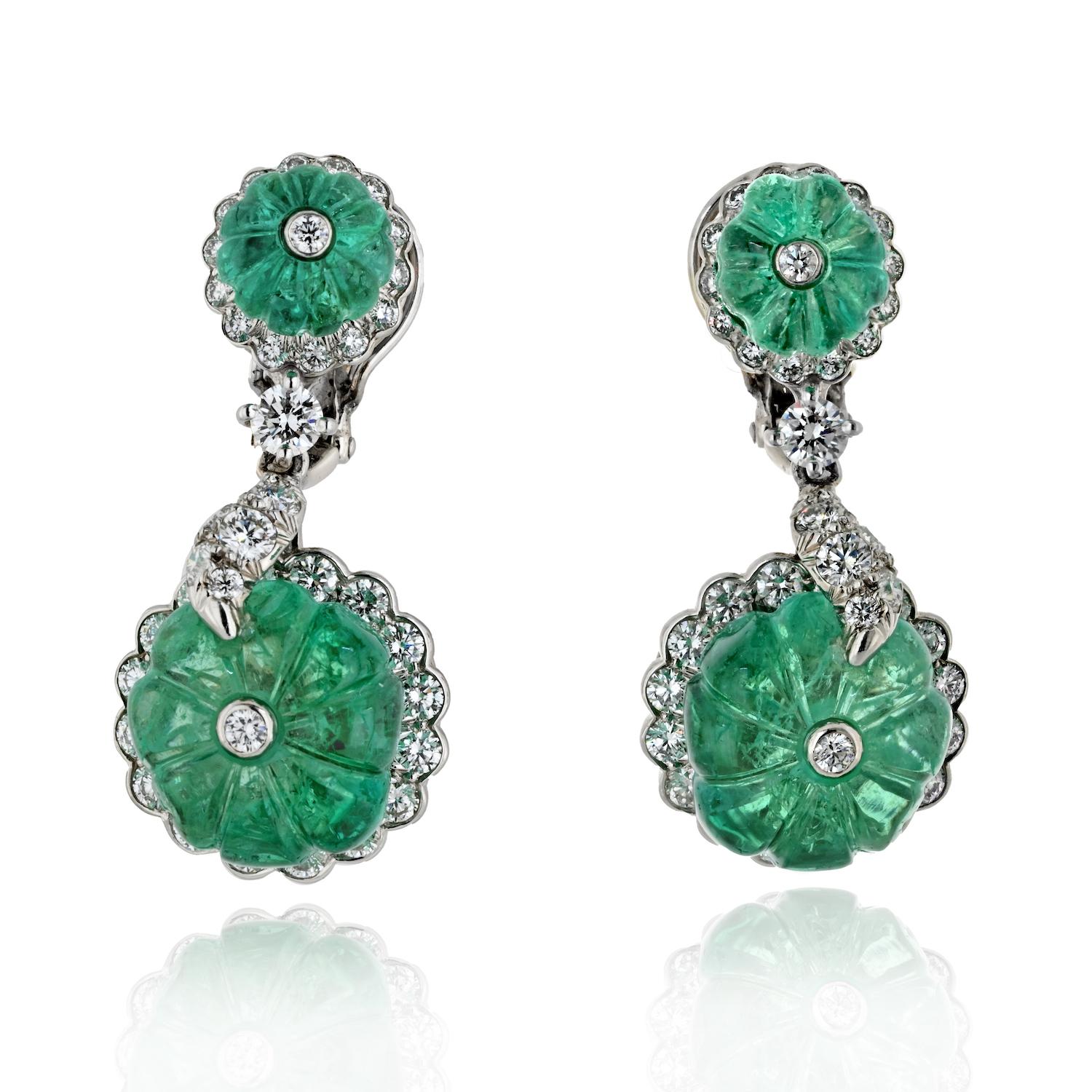 Indulge in the luxurious allure of the David Webb Platinum Carved Green Emerald and Diamond Drop Earrings, where the rich green hues of emeralds meet the brilliance of diamonds in an exquisite design.

**Key Features:**

1. **Material:**
   -