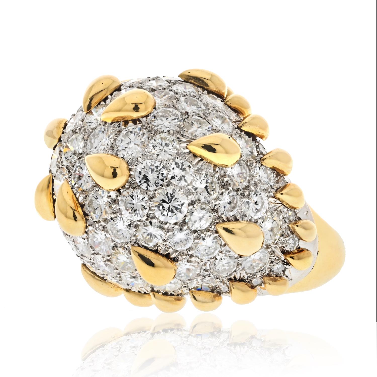 The diamond dome ring designed by David Webb is a true masterpiece of jewelry design. It is crafted in platinum and 18k yellow gold, which give the ring a classic and timeless appeal. The ring features a stunning diamond dome surface that sparkles