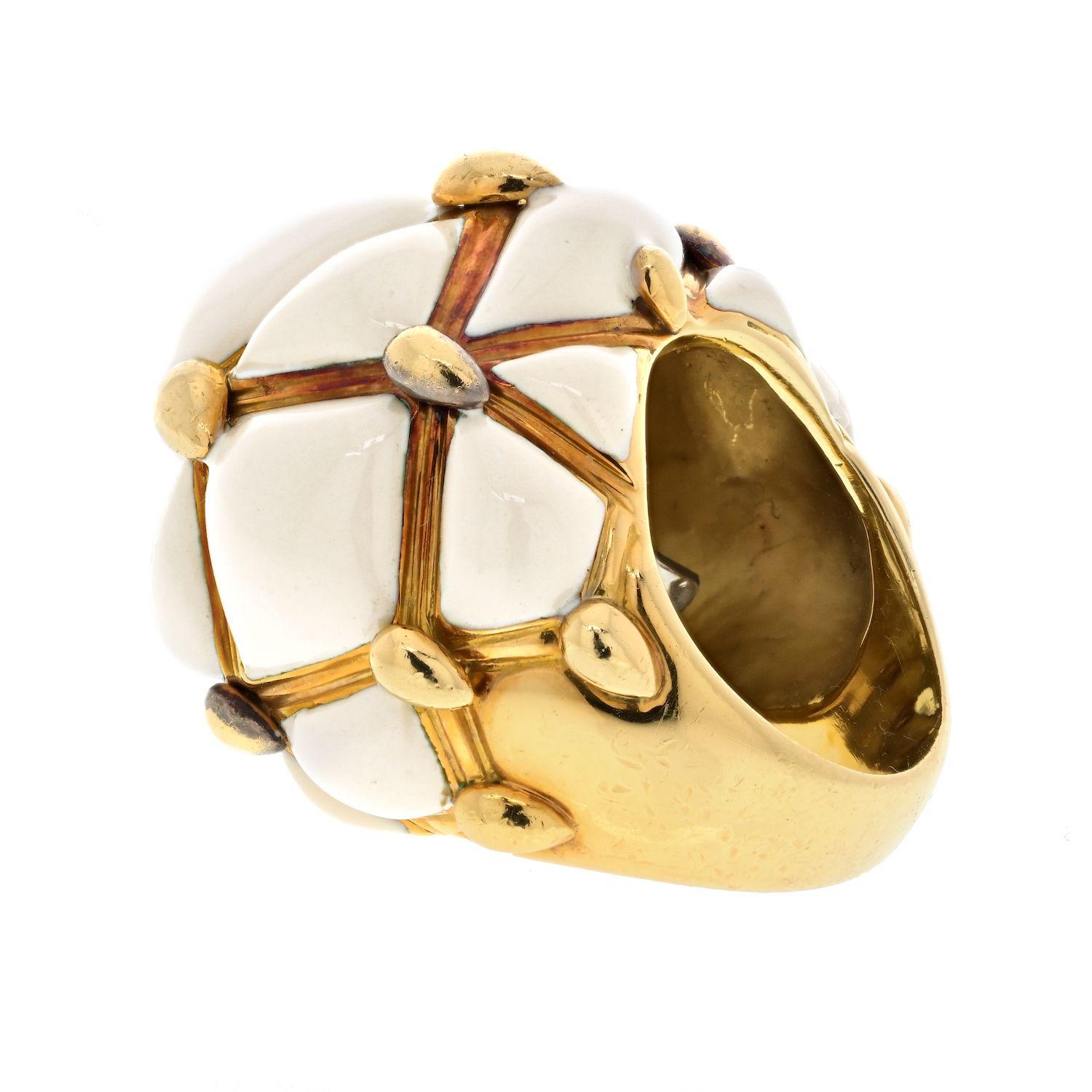 Make a bold statement with the David Webb Geodesic Patterned Domed Cocktail Ring. This exquisite piece is crafted in 18k yellow gold, showcasing the brand's commitment to exceptional quality and design. The ring features a captivating geodesic
