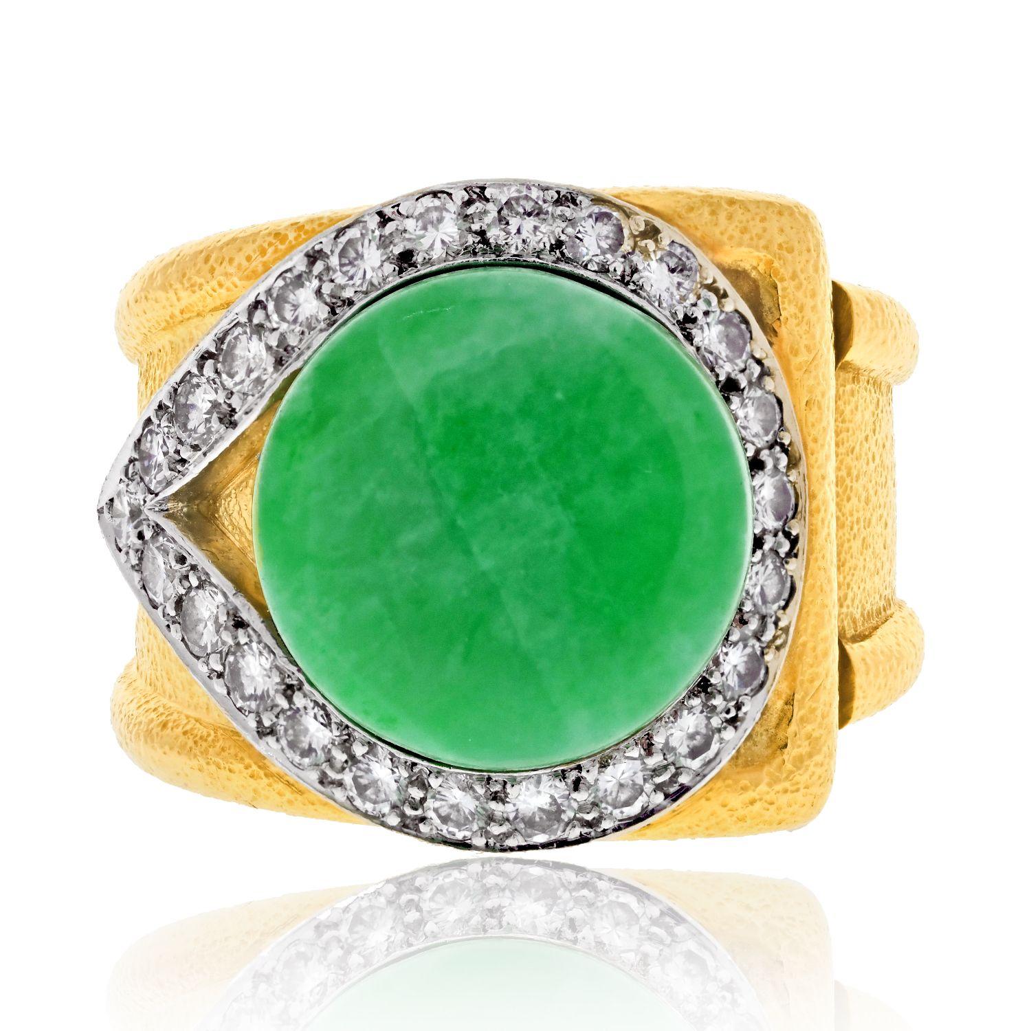 Exquisite craftsmanship and captivating design merge seamlessly in this David Webb Platinum & 18K Yellow Gold Jadeite Diamond Hammered Finish Cocktail Ring. The focal point of the ring is a round, flat-shaped jadeite, radiating its natural beauty