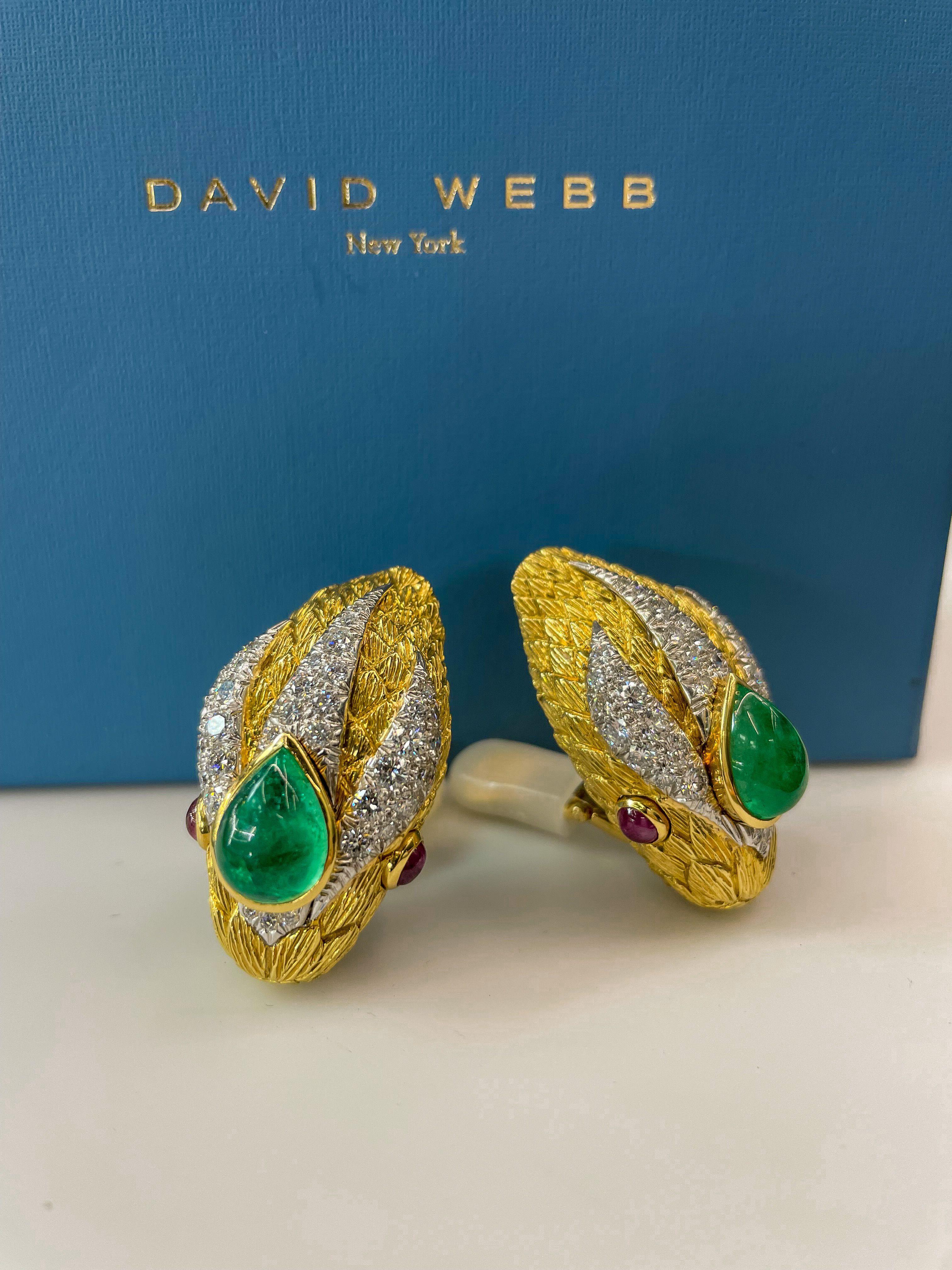 David Webb was a master jewelry designer, known for his bold and unique designs that often featured natural motifs. One such piece is his 18k yellow gold clip earrings fashioned as serpent heads, mounted with green cabochon cut green emeralds on the