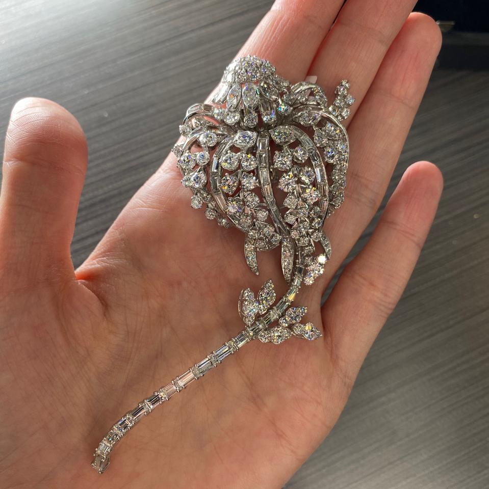 An original one-of-a-kind vintage David Webb design. Classic materials come together to form this fabulous diamond and platinum long-stemmed flower brooch. Set with over twenty (25) carats of fine diamonds, this brooch is sure to impress.
Wear it