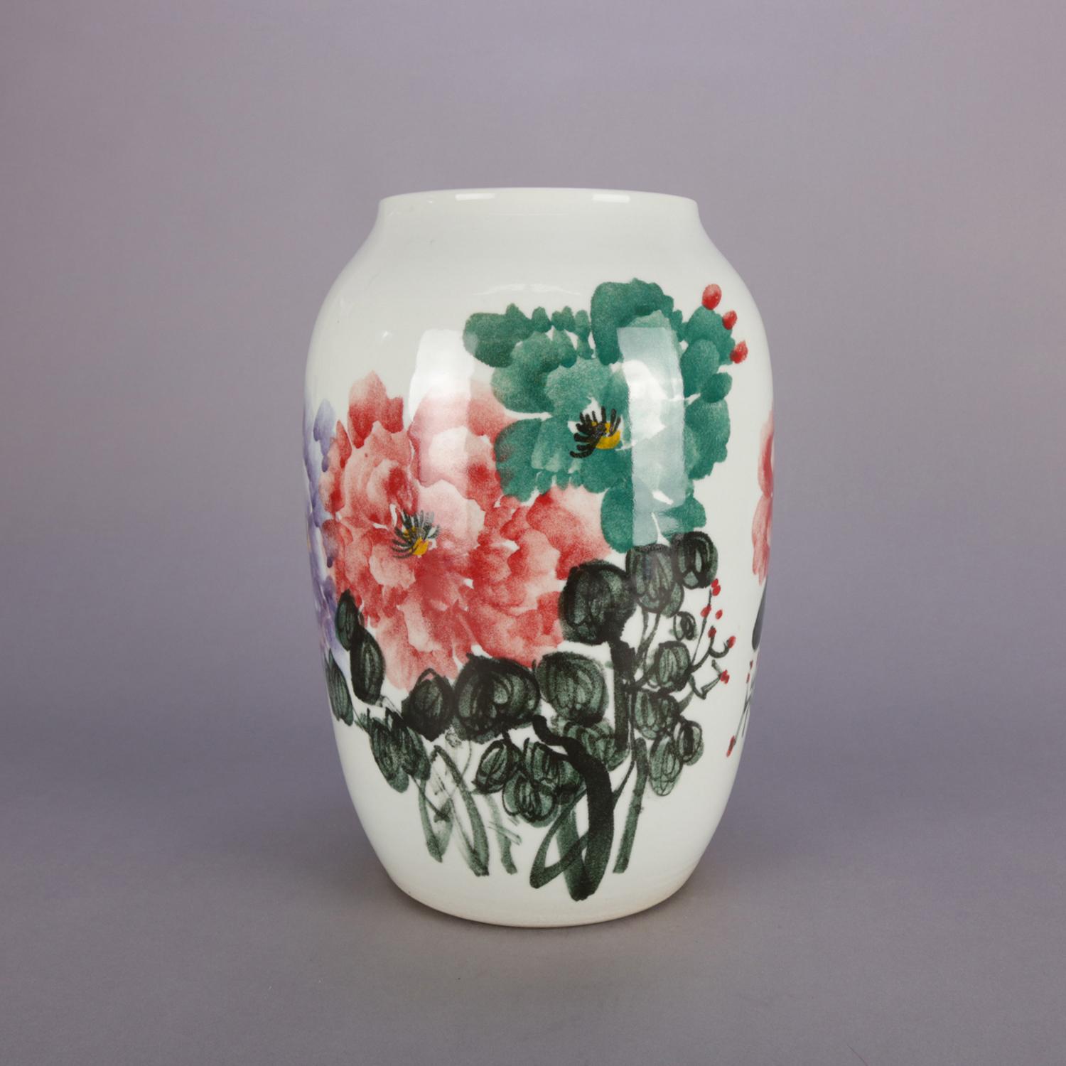 Chinese porcelain vase features hand-painted floral bouquet of peonies with chop mark signing, 20th century

Measures: 13.25