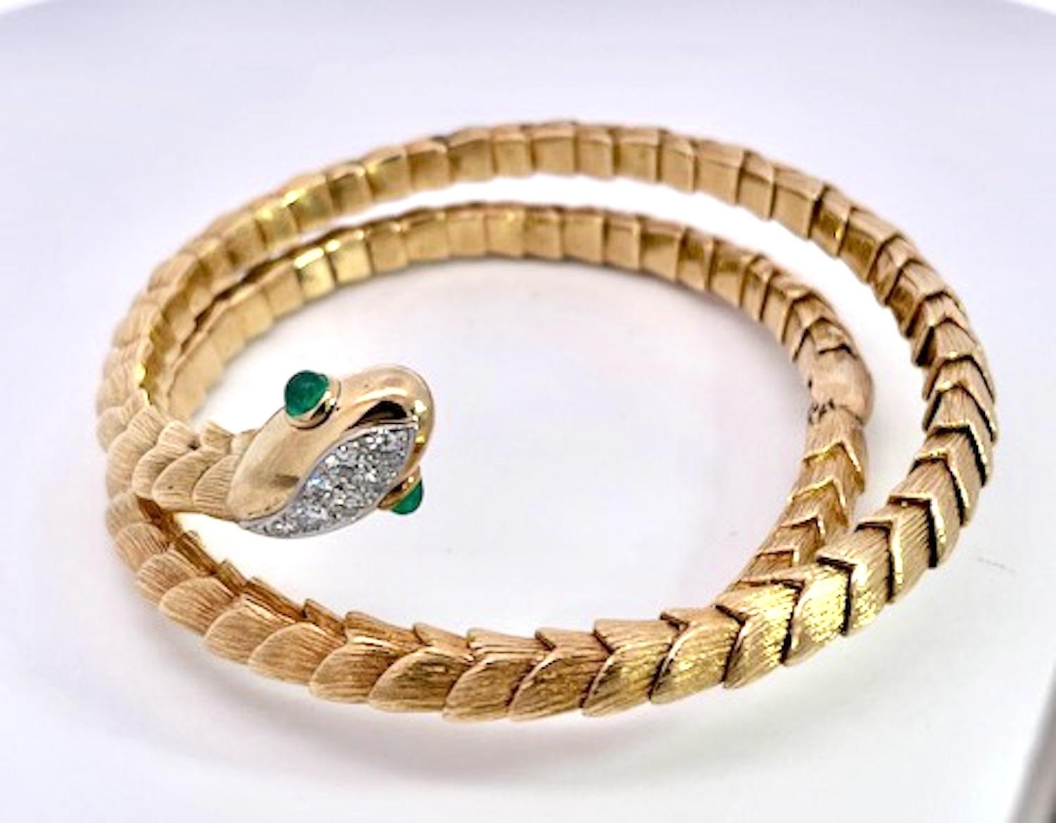 This David Webb Snake Bracelet is rare.  I have only seen it once before in 15 years.  This bracelet is a coil that runs around the wrist twice.  The face is lovely with a Diamond head and two Cabochon Emerald eyes.  This piece is in very good