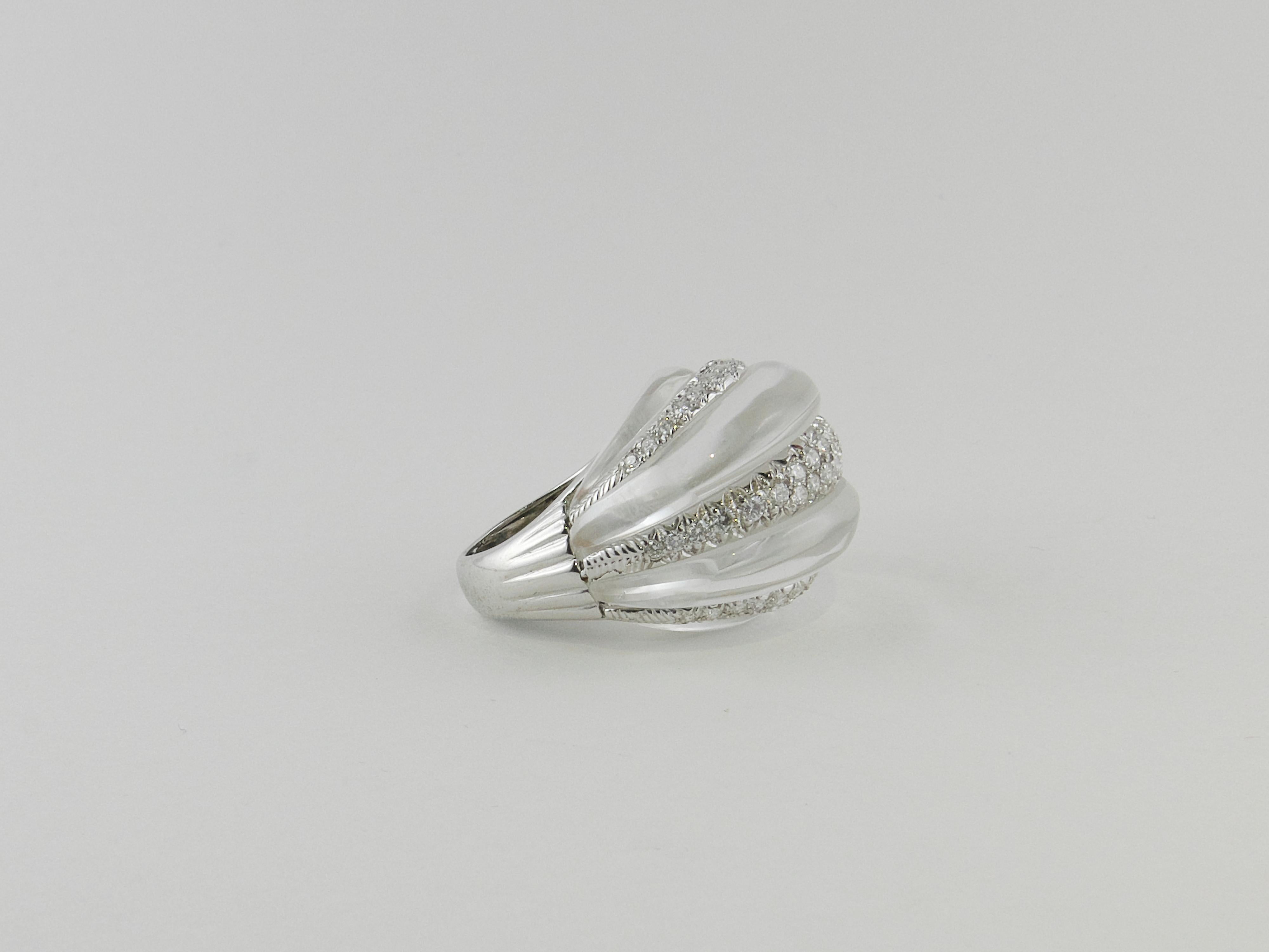 An extremely chic and opulent  fluted Rock Crystal, and brilliant-cut Diamonds dome Ring signed David Webb.
Crafted in the 1970s with uncompromising attention to detail, and  with the finest materials, this distintive and imposing cocktail Ring